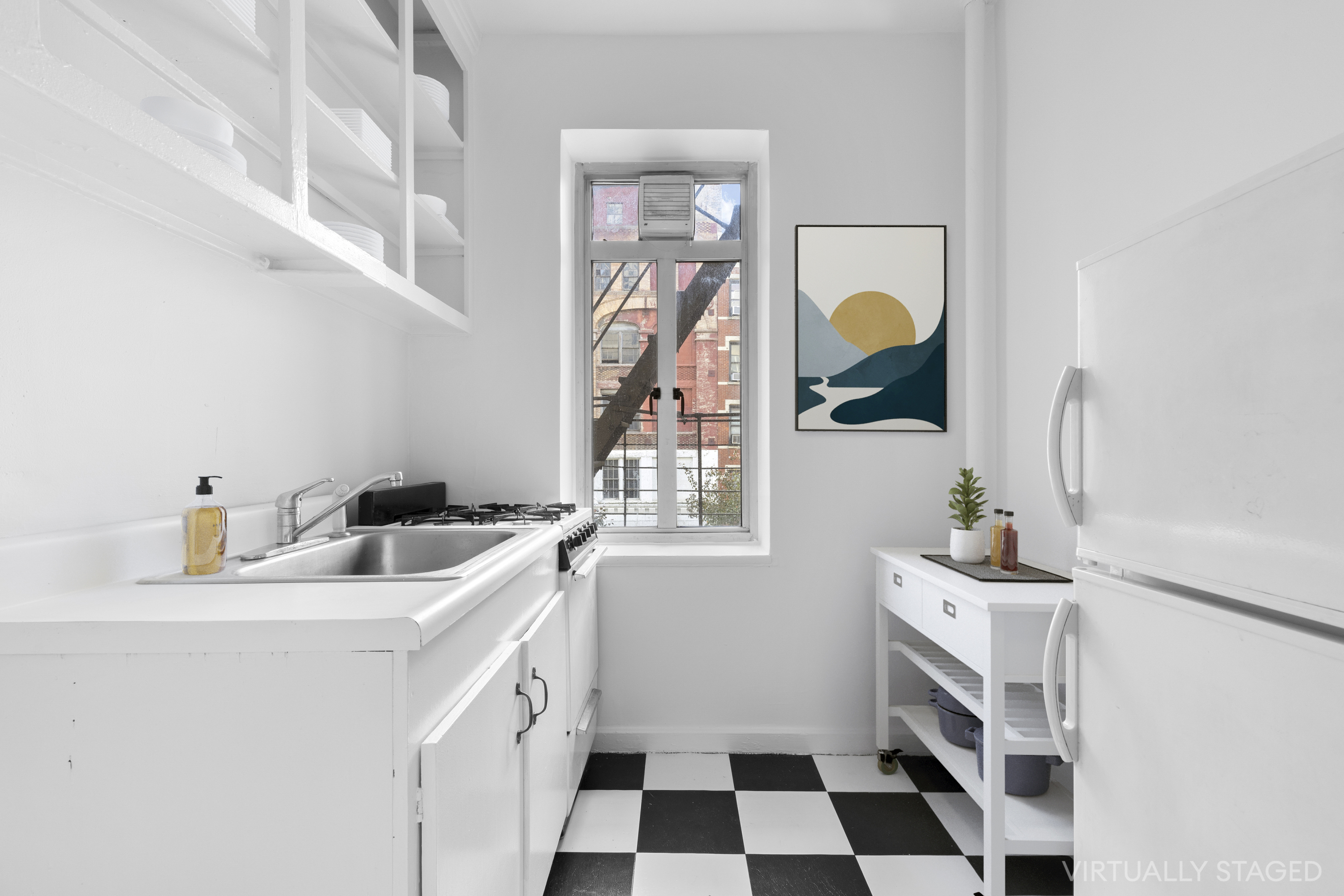 155 West 20th Street, Unit 4F Manhattan, NY 10011 - Photo 4 of 7 a kitchen with a sink stove and mirror