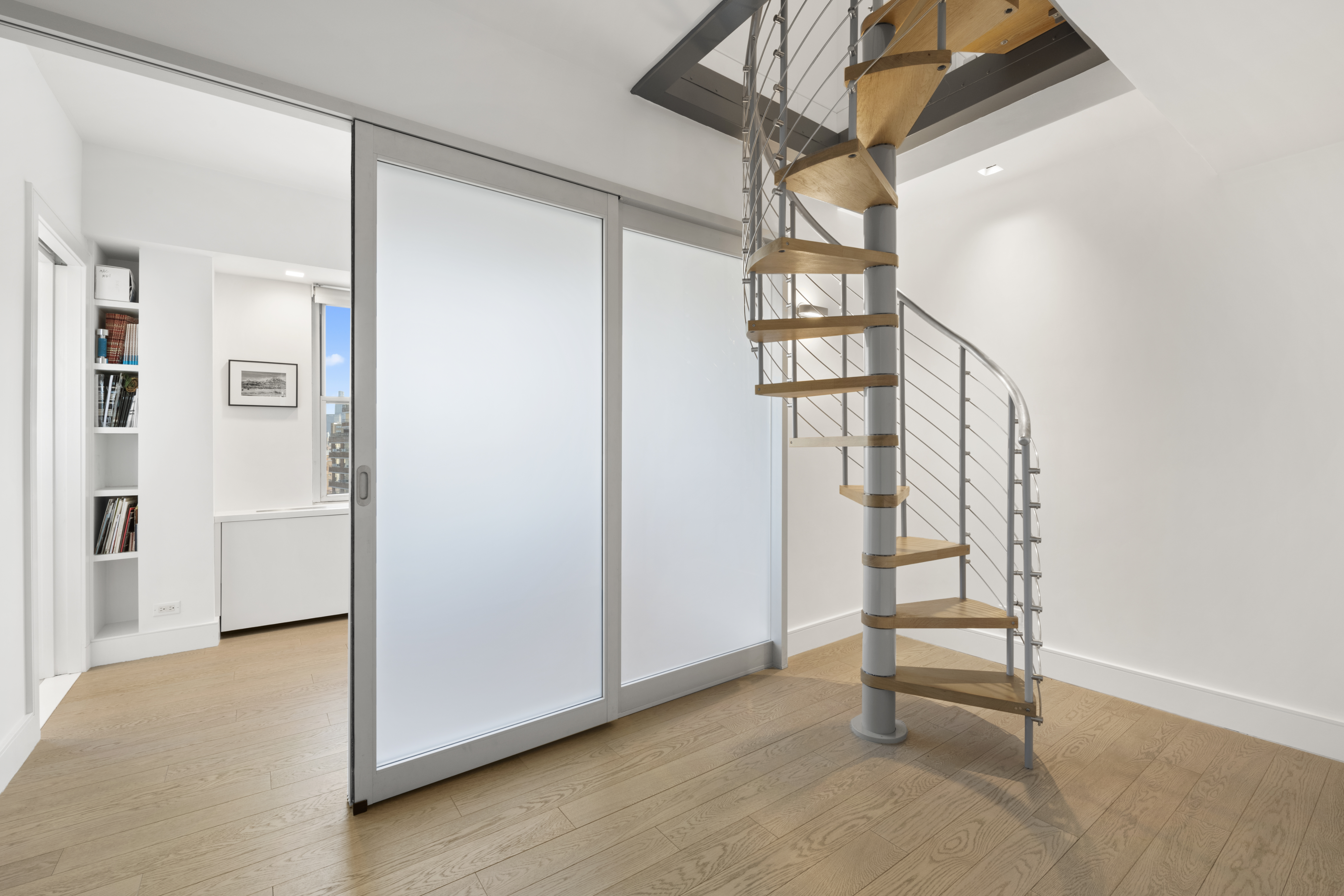 573 Grand Street, Unit D1707/1801 Manhattan, NY 10002 - Photo 14 of 24 a view of front door with stairs