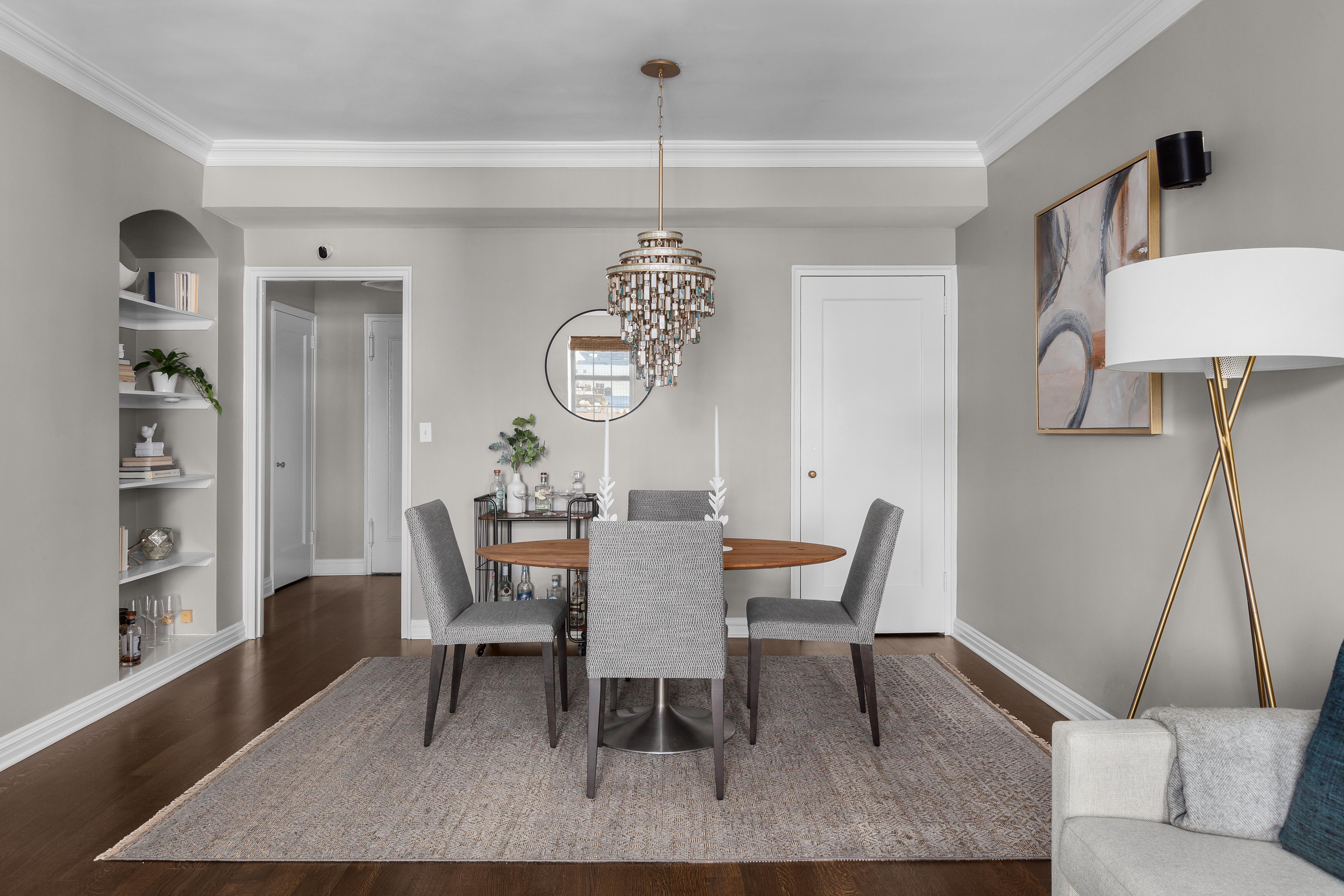 470 West 24th Street, Unit 16H Manhattan, NY 10011 - Photo 5 of 13 a dining room with furniture and a chandelier