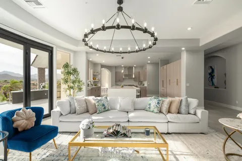 a bedroom with furniture and a floor to ceiling window