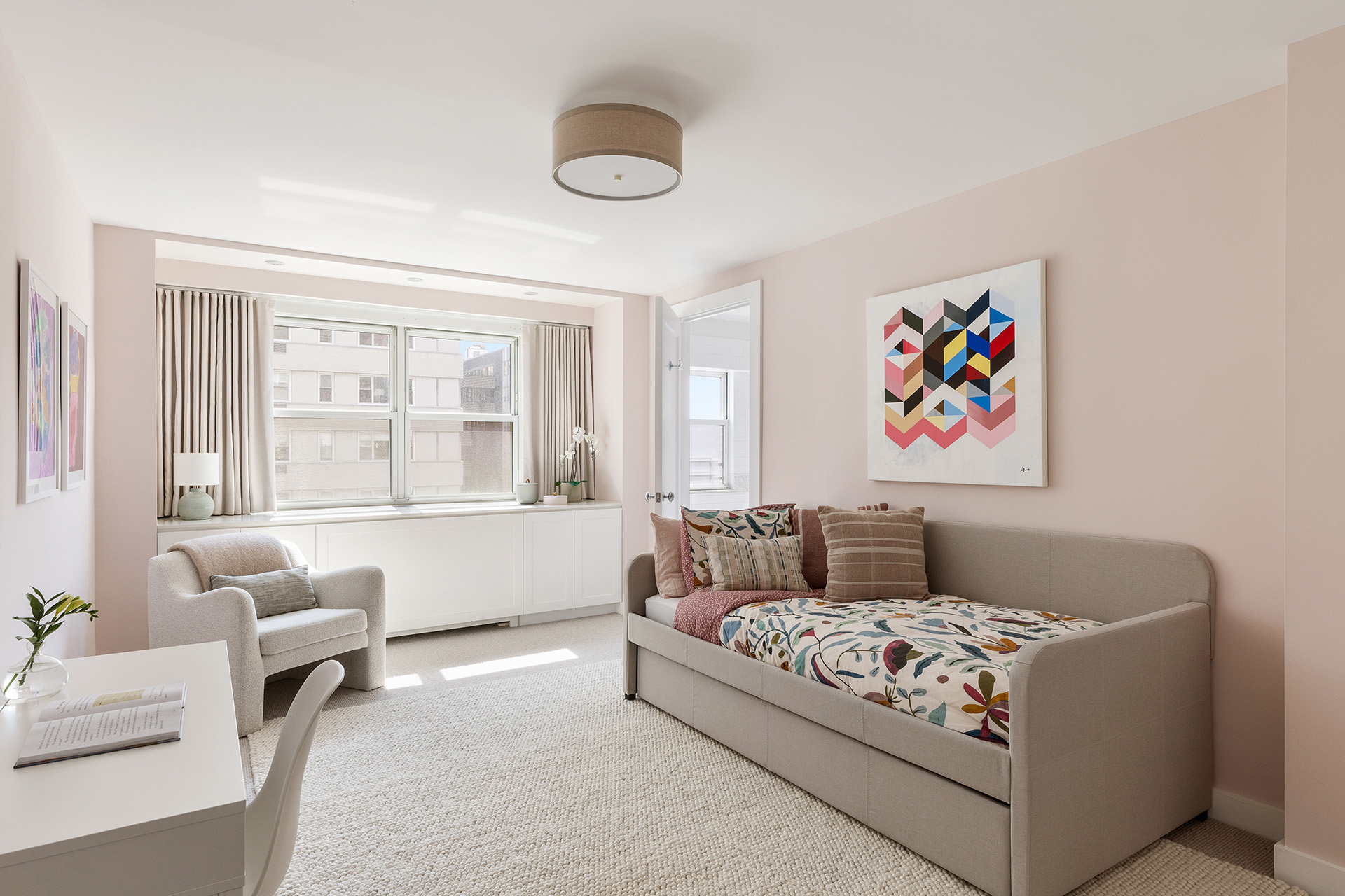 101 West 12th Street, Unit 8RS Manhattan, NY 10011 - Photo 12 of 19 a living room with furniture and a large window