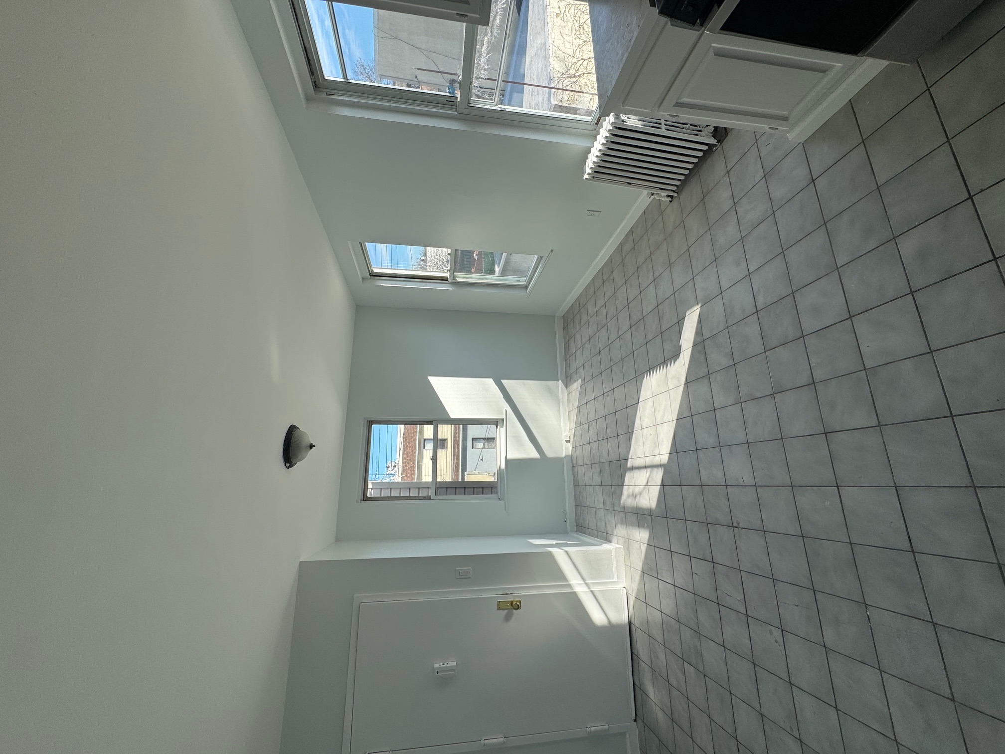 89-16 102nd Road, Unit 2 Queens, NY 11416 - Photo 4 of 13 a view of empty room with wooden floor