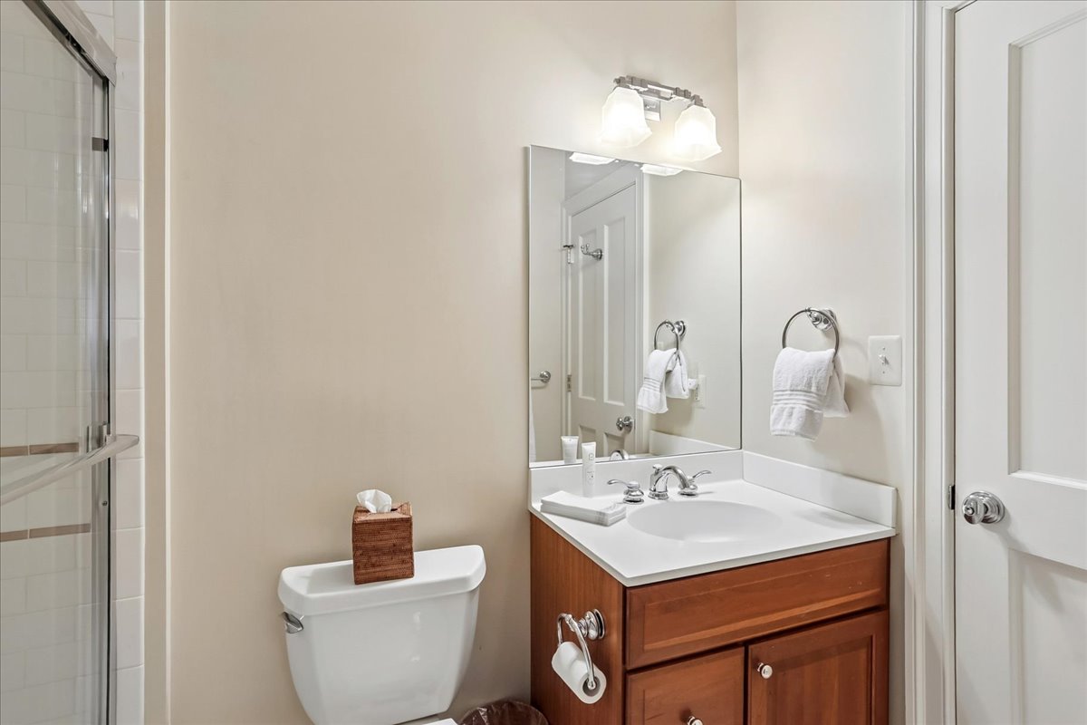 11736 Gainsborough Road Potomac, MD 20854 - Photo 85 of 90 a bathroom with a toilet sink and mirror
