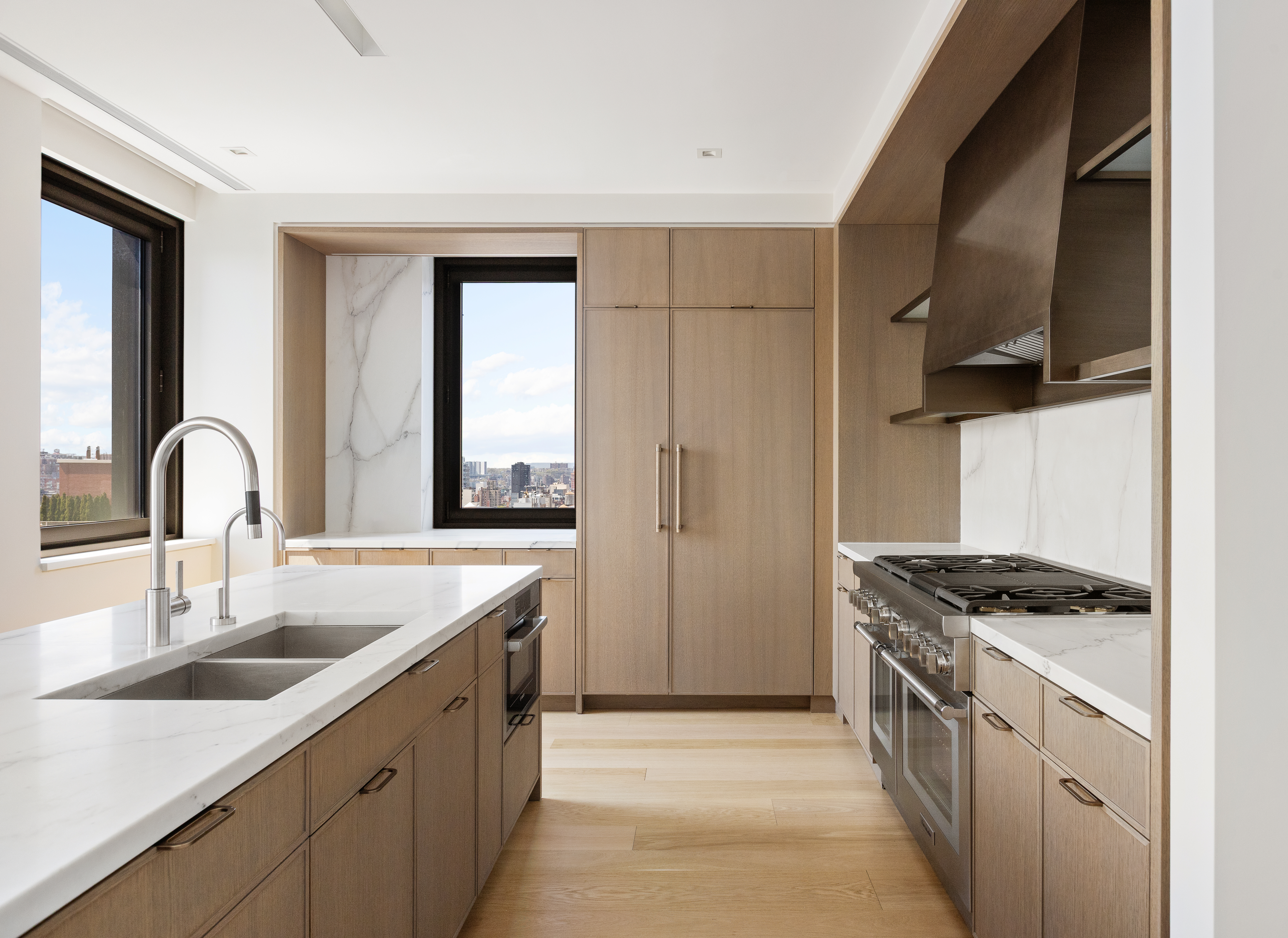 39 West 23rd Street, Unit 21A Manhattan, NY 10010 - Photo 6 of 14 a kitchen with stainless steel appliances granite countertop a sink stove and cabinets