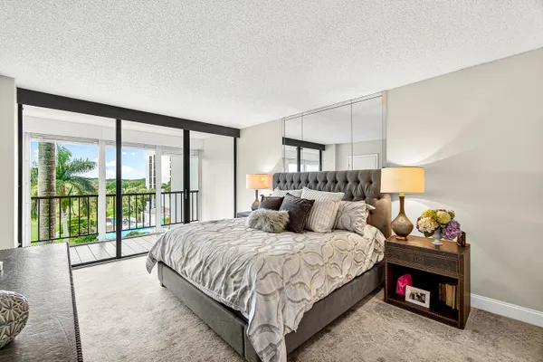 a bedroom with a bed and a couch
