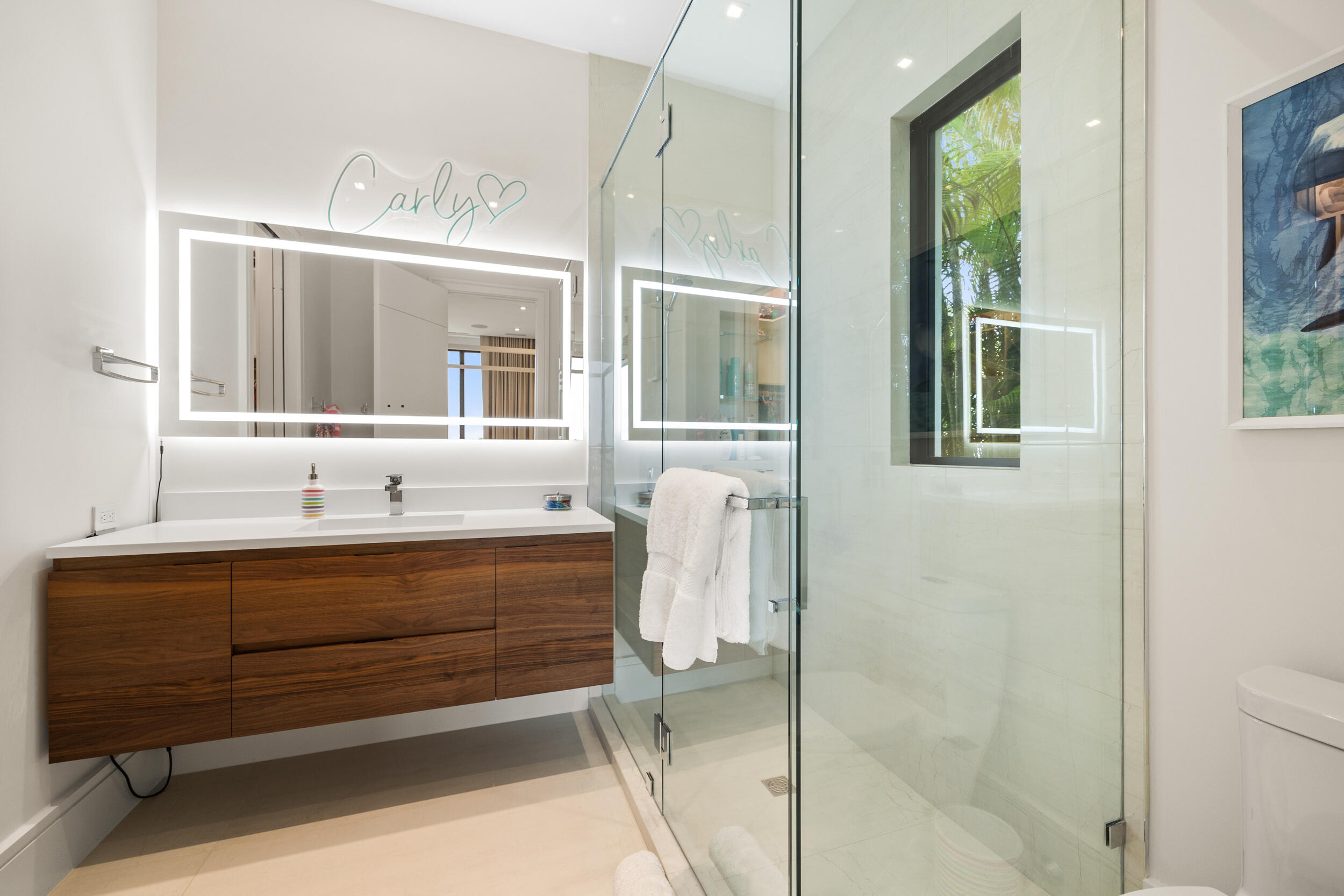 5695 Pennock Point Road Jupiter, FL 33458 - Photo 54 of 77 a bathroom with a sink and a mirror