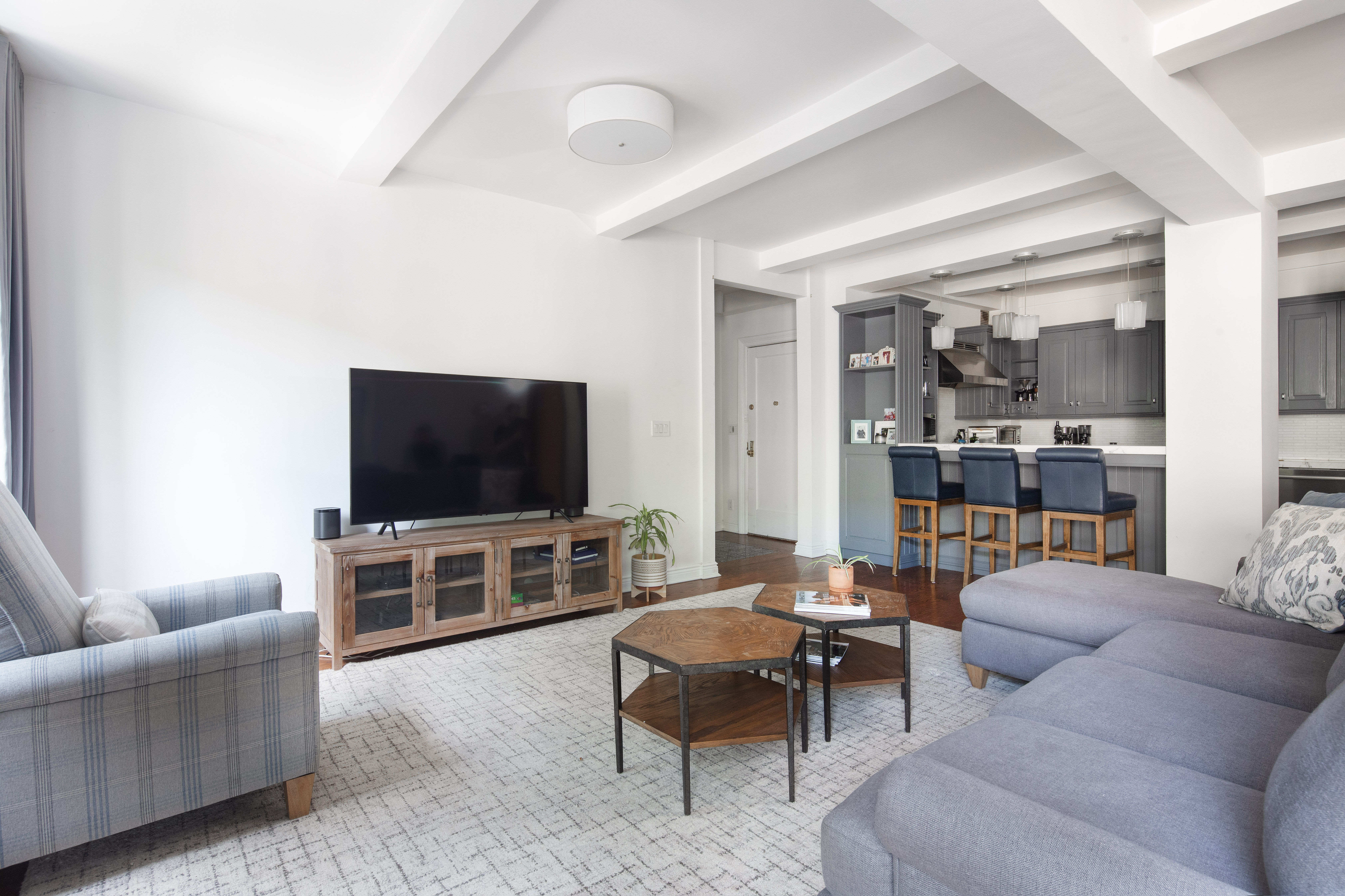 60 West 68th Street, Unit 5B Manhattan, NY 10023 - Photo 2 of 7 a living room with furniture and a flat screen tv