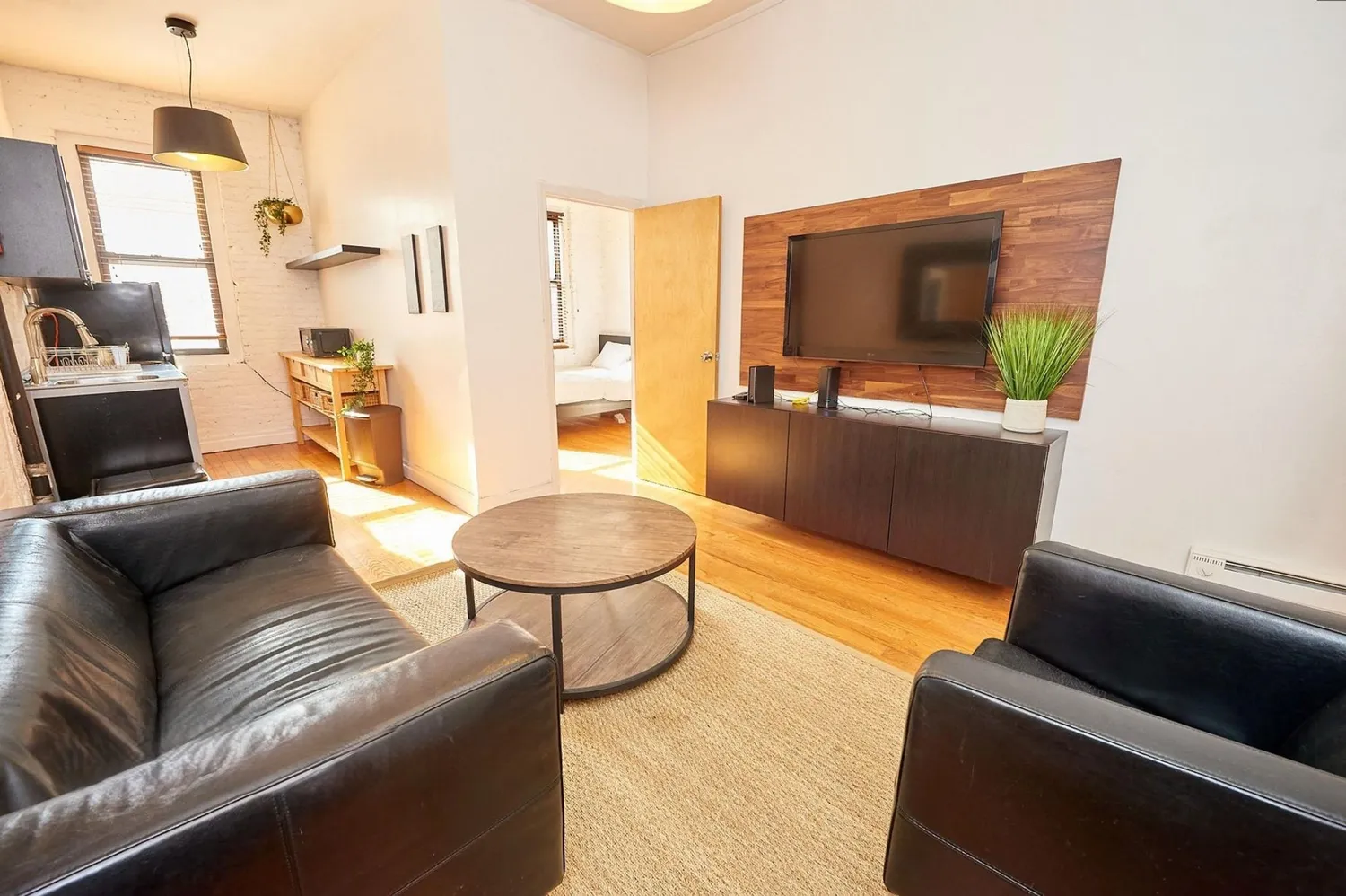 a living room with furniture and a flat screen tv