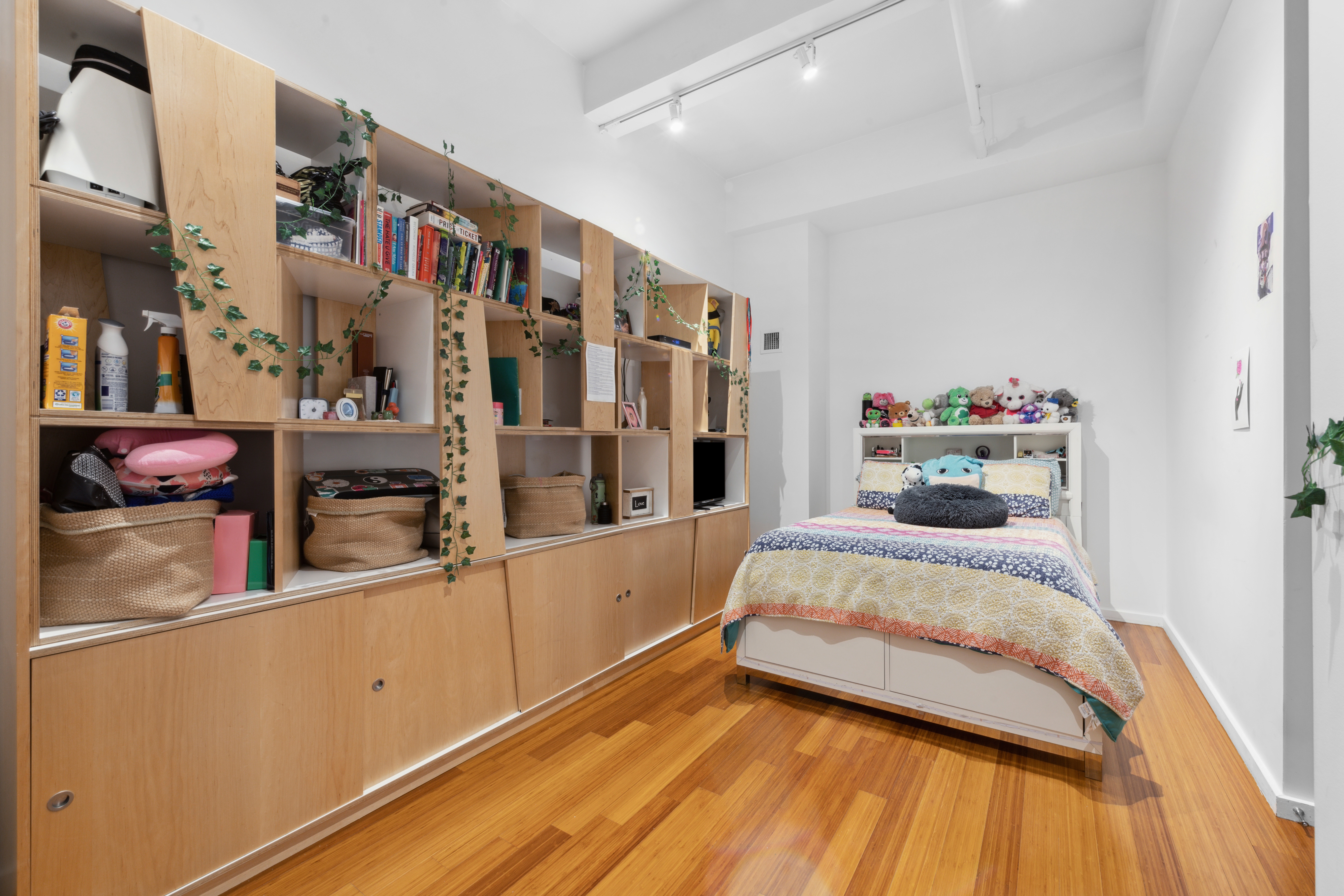 365 Bridge Street, Unit 12H Brooklyn, NY 11201 - Photo 7 of 12 a bedroom with a bed and wooden floor