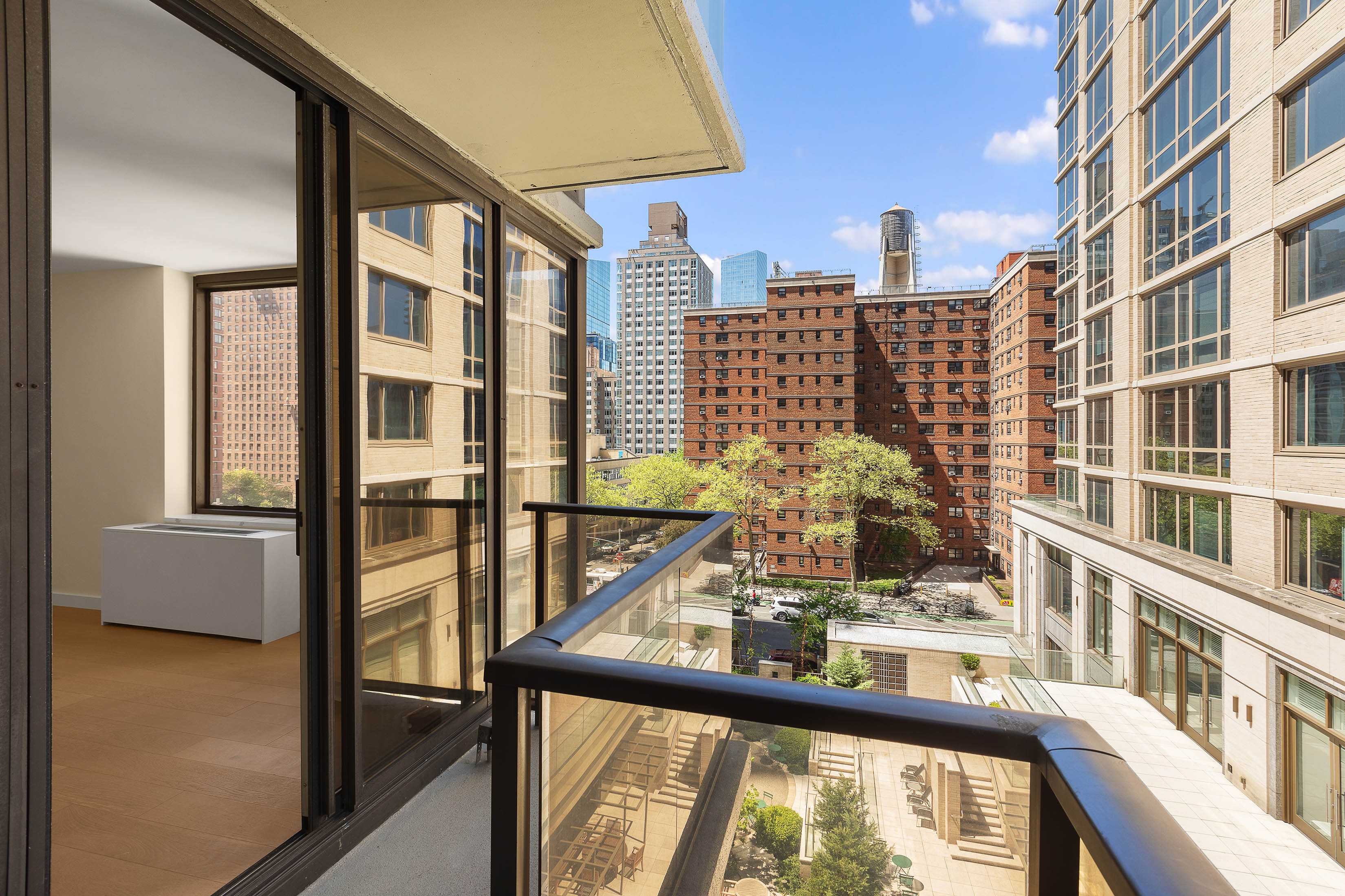 161 West 61st Street, Unit 5C Manhattan, NY 10023 - Photo 20 of 30 a view of a city from a balcony