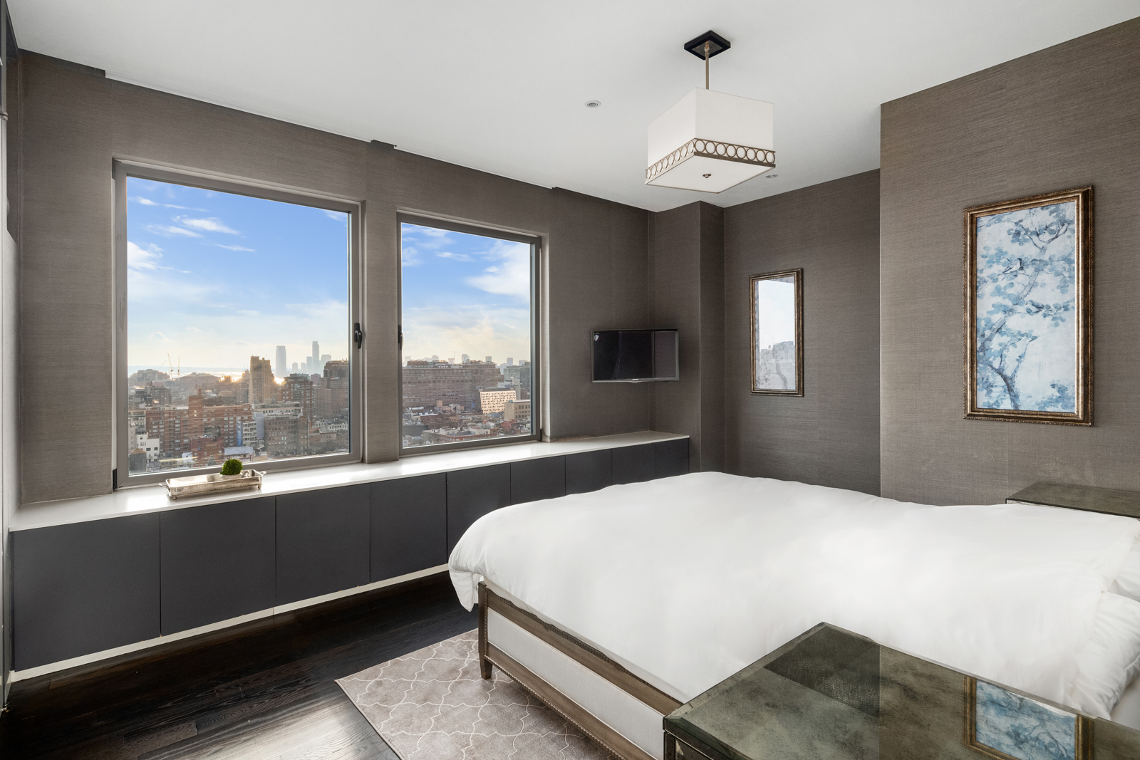 252 7th Avenue, Unit PHD Manhattan, NY 10001 - Photo 24 of 26 a bedroom with a large bed and a large window