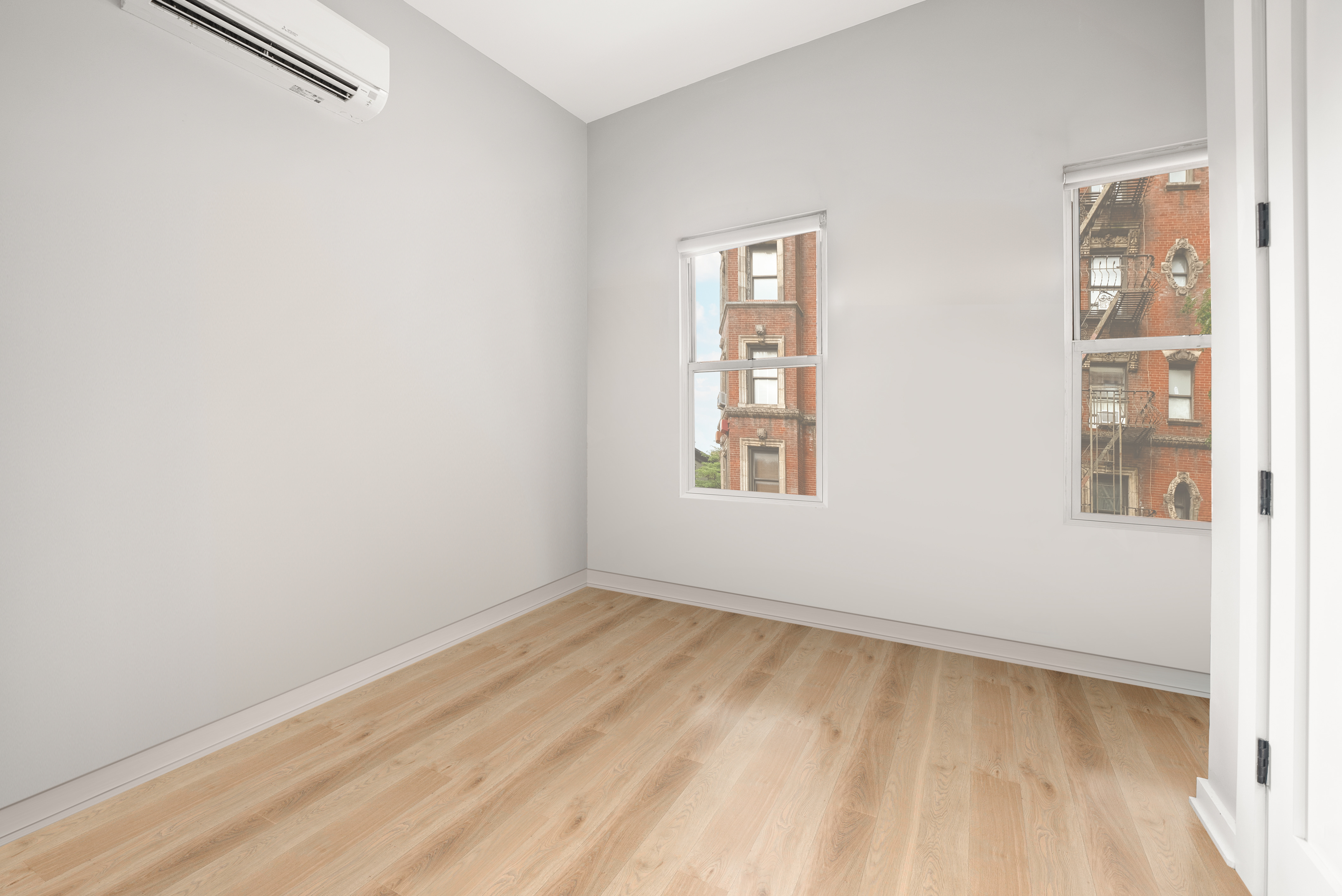 275 Bleecker Street, Unit 4 Manhattan, NY 10014 - Photo 5 of 10 an empty room with windows