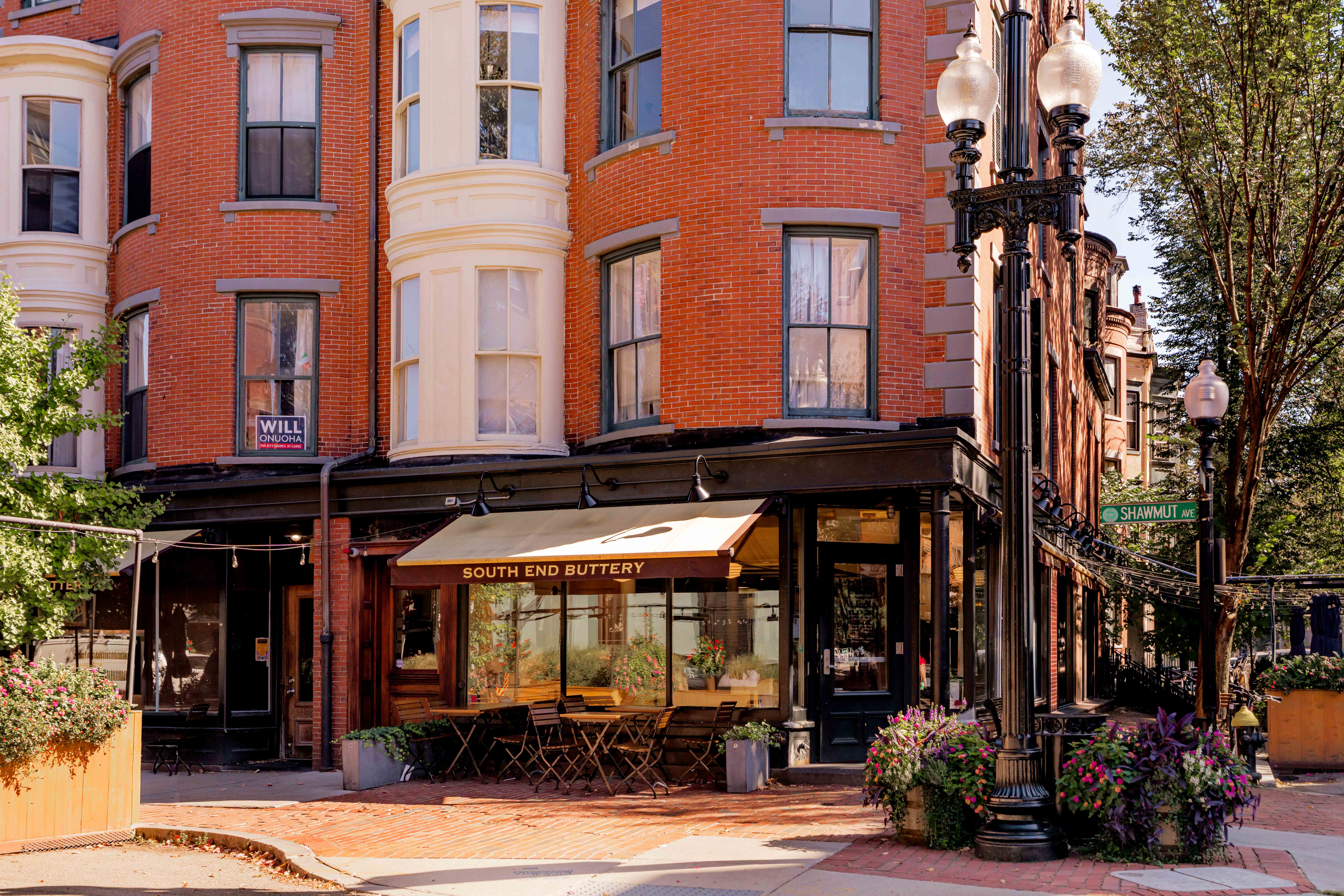 92 Waltham Street, Unit 1A Boston, MA 02118 - Photo 11 of 18 front view of a building with a lot of windows and plants