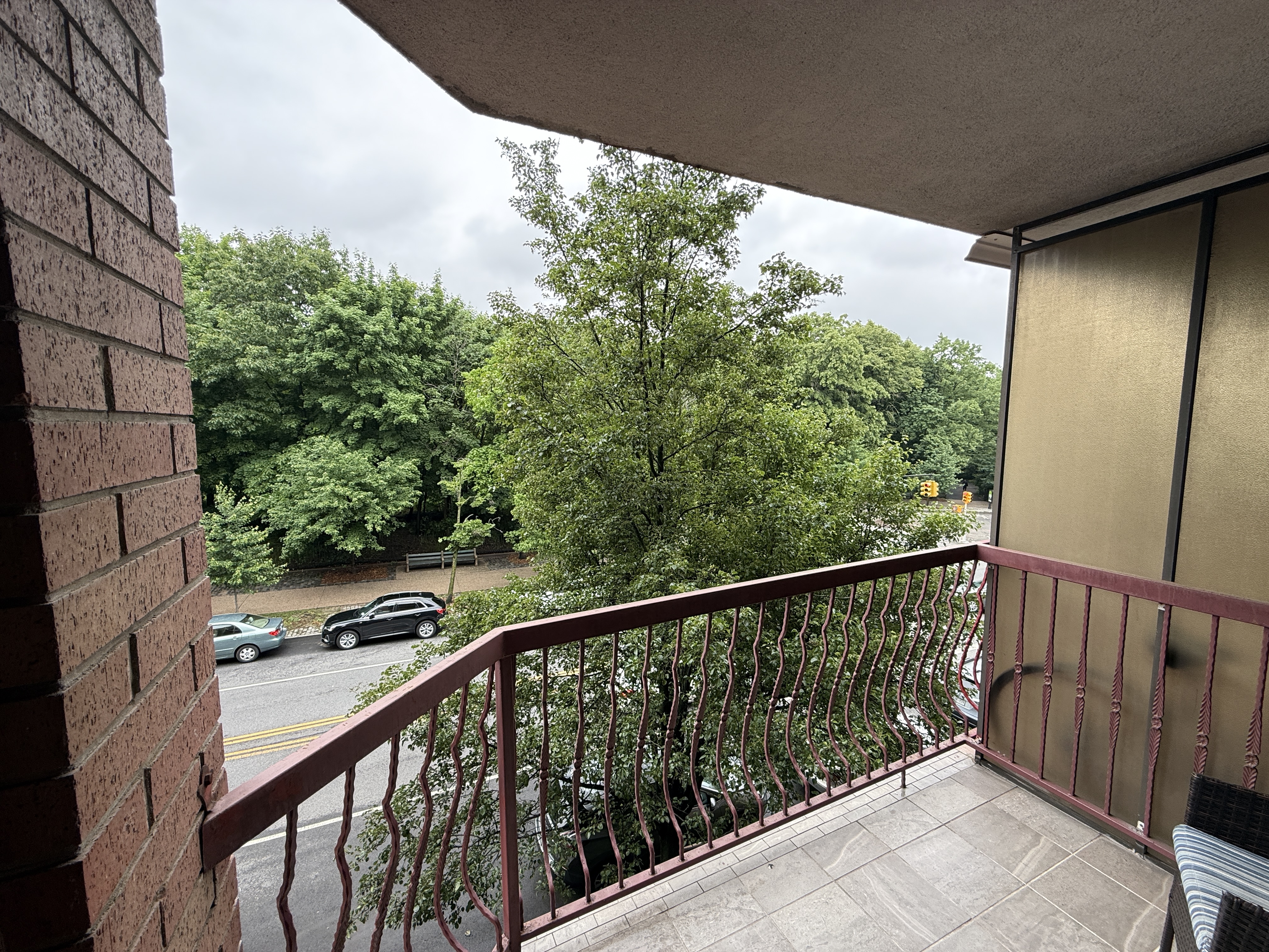 101 Prospect Park Southwest, Unit 3B Brooklyn, NY 11218 - Photo 1 of 23 a side view of a balcony with wooden floor