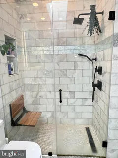 a bathroom with a toilet and shower