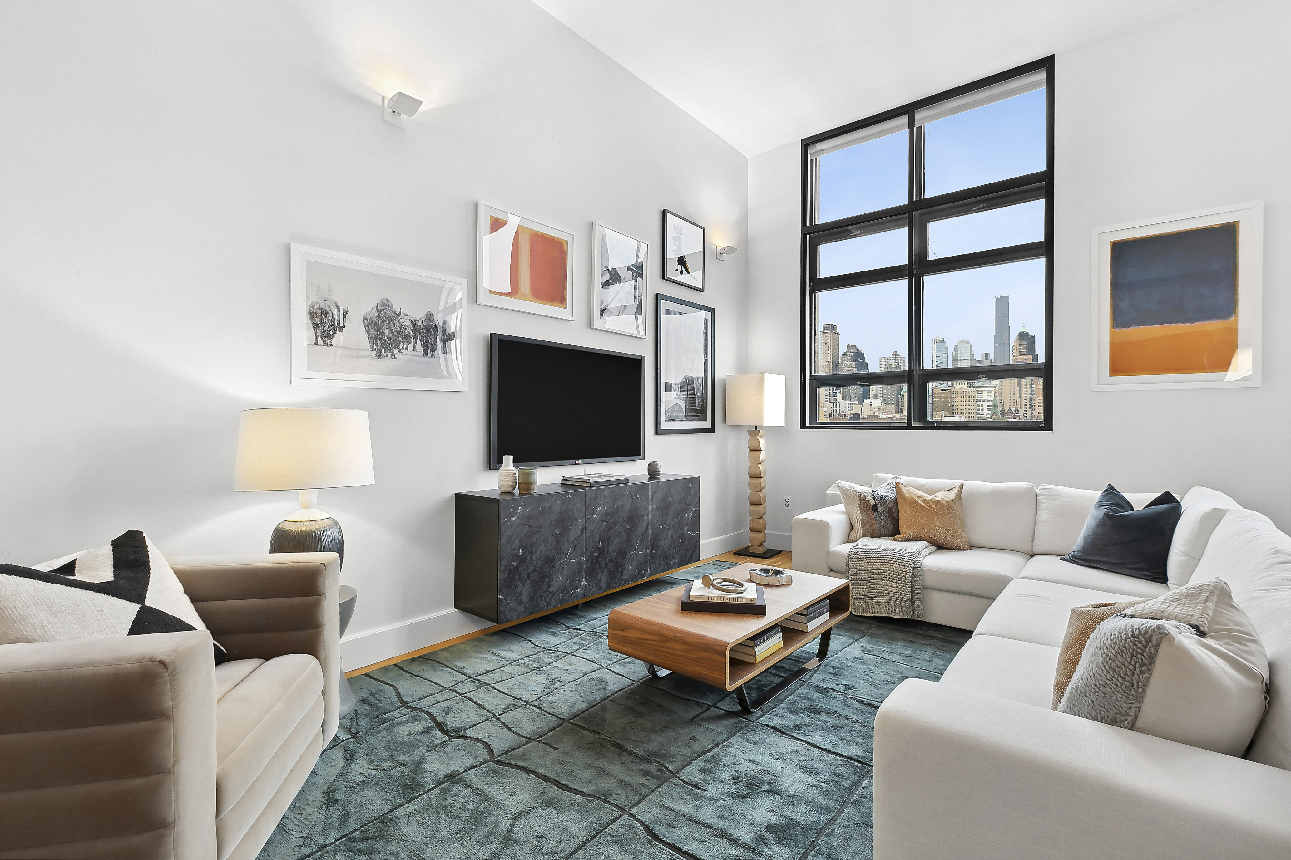 360 Furman Street, Unit 812 Brooklyn, NY 11201 - Photo 3 of 39 a living room with furniture a flat screen tv and a window