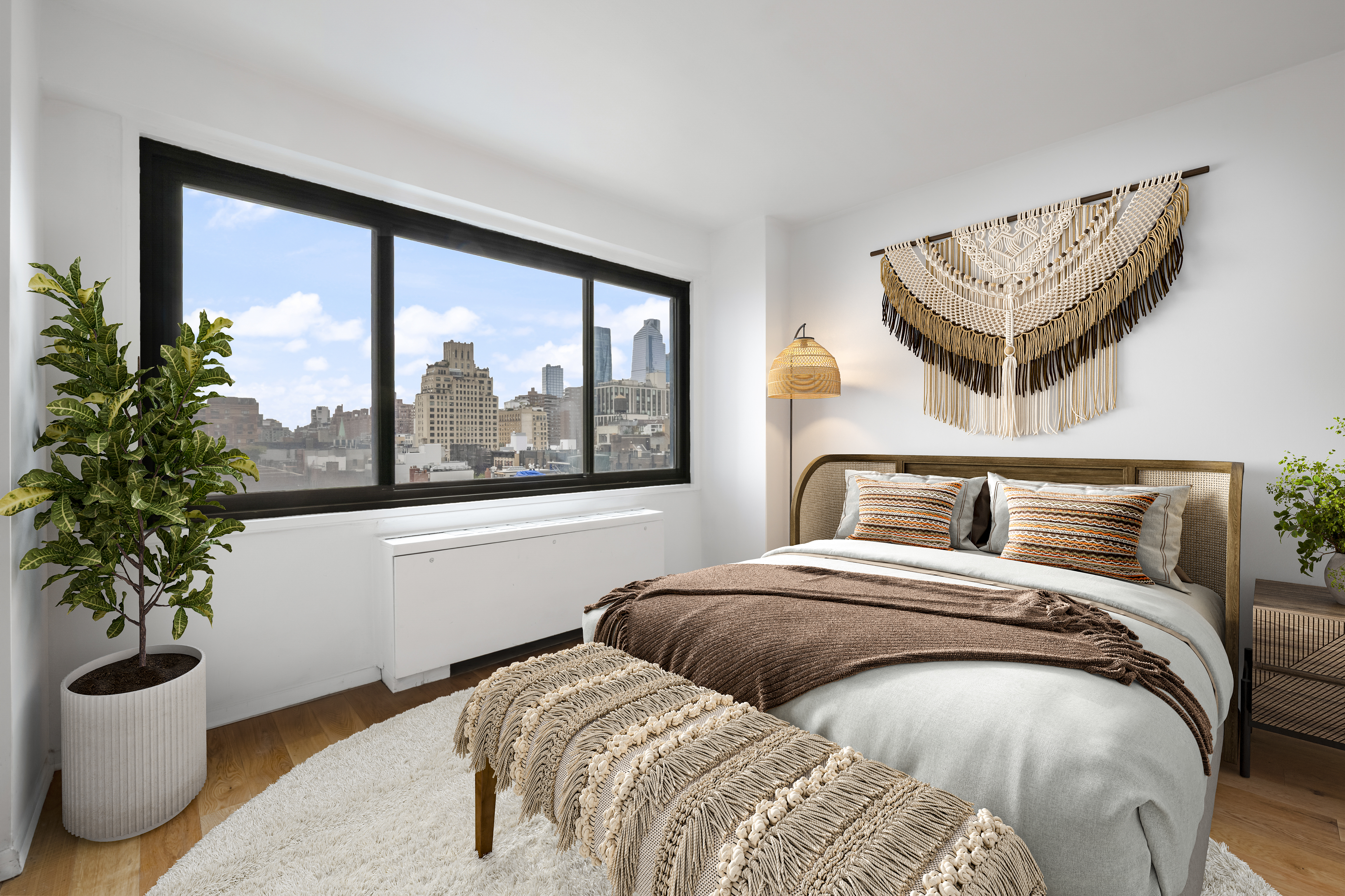 201 West 21st Street, Unit 9A Manhattan, NY 10011 - Photo 3 of 13 a bedroom with a large bed and a potted plant