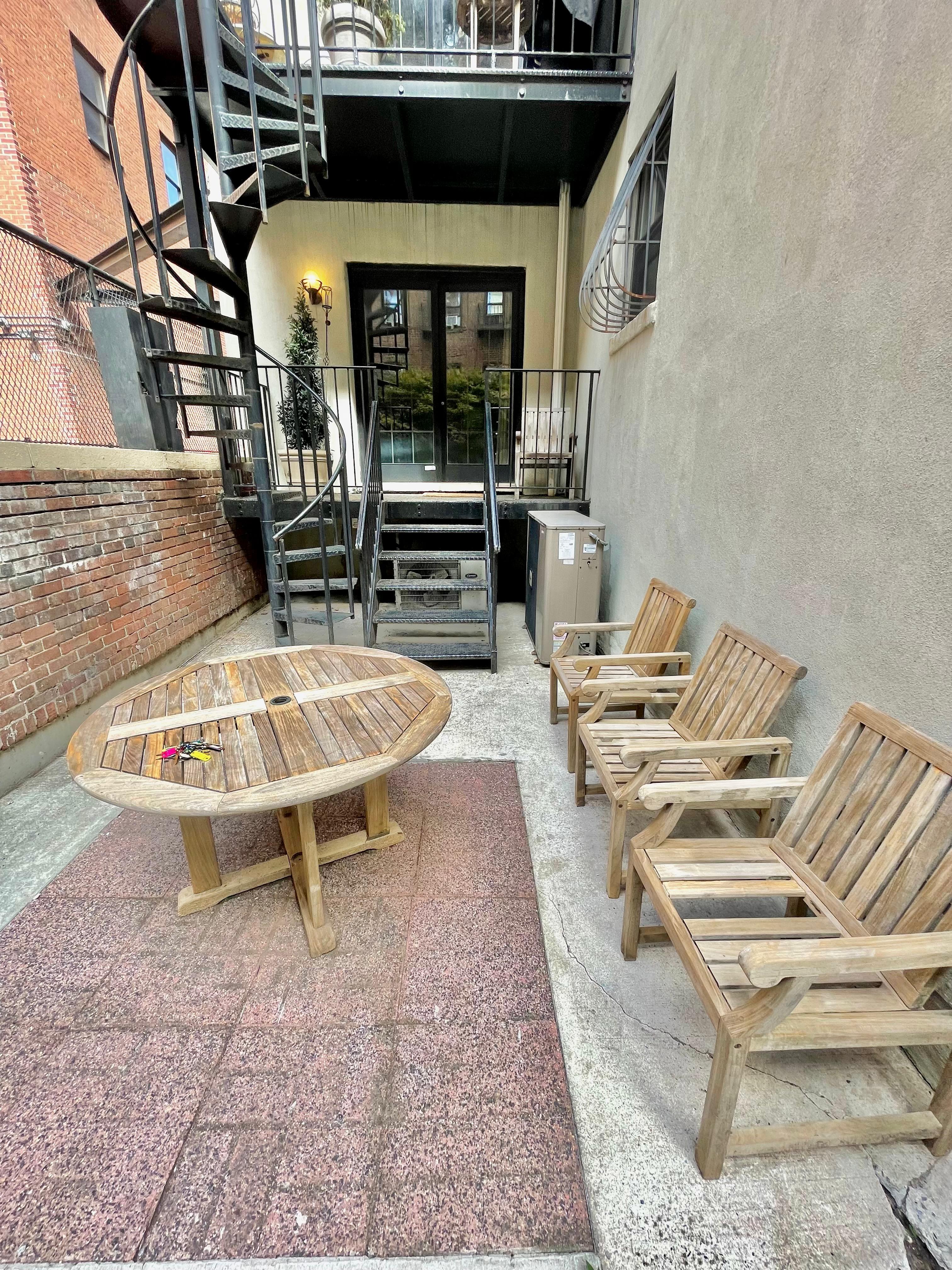 710 St Nicholas Avenue, Unit 1 Manhattan, NY 10032 - Photo 12 of 15 a view of a chairs and table in the patio