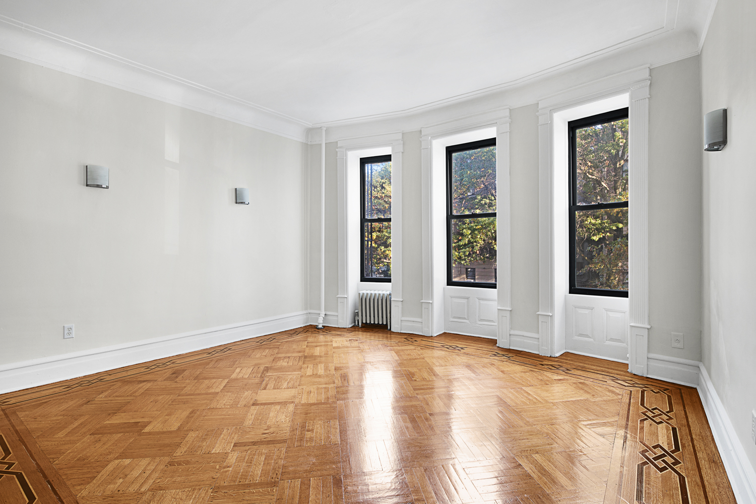 408 8th Avenue, Unit 2A Brooklyn, NY 11215 - Photo 1 of 7 a view of an empty room with window and wooden floor