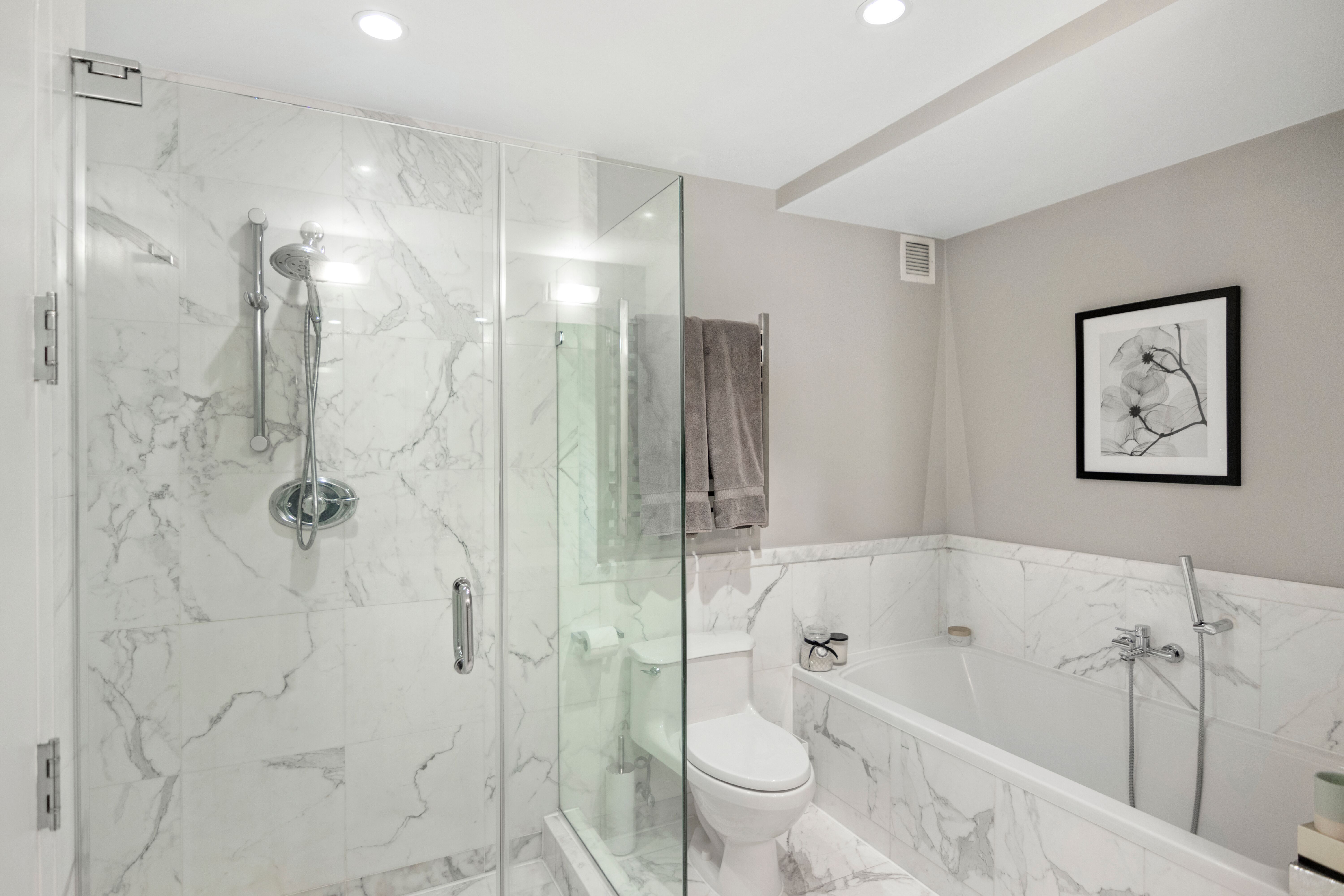 224 West 18th Street, Unit 6C Manhattan, NY 10011 - Photo 12 of 21 a bathroom with a bathtub shower sink mirror and toilet