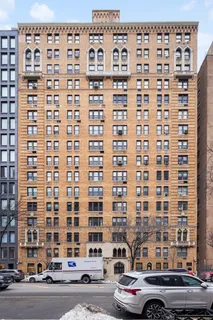 a spacious bedroom with a large bed and a large dresser