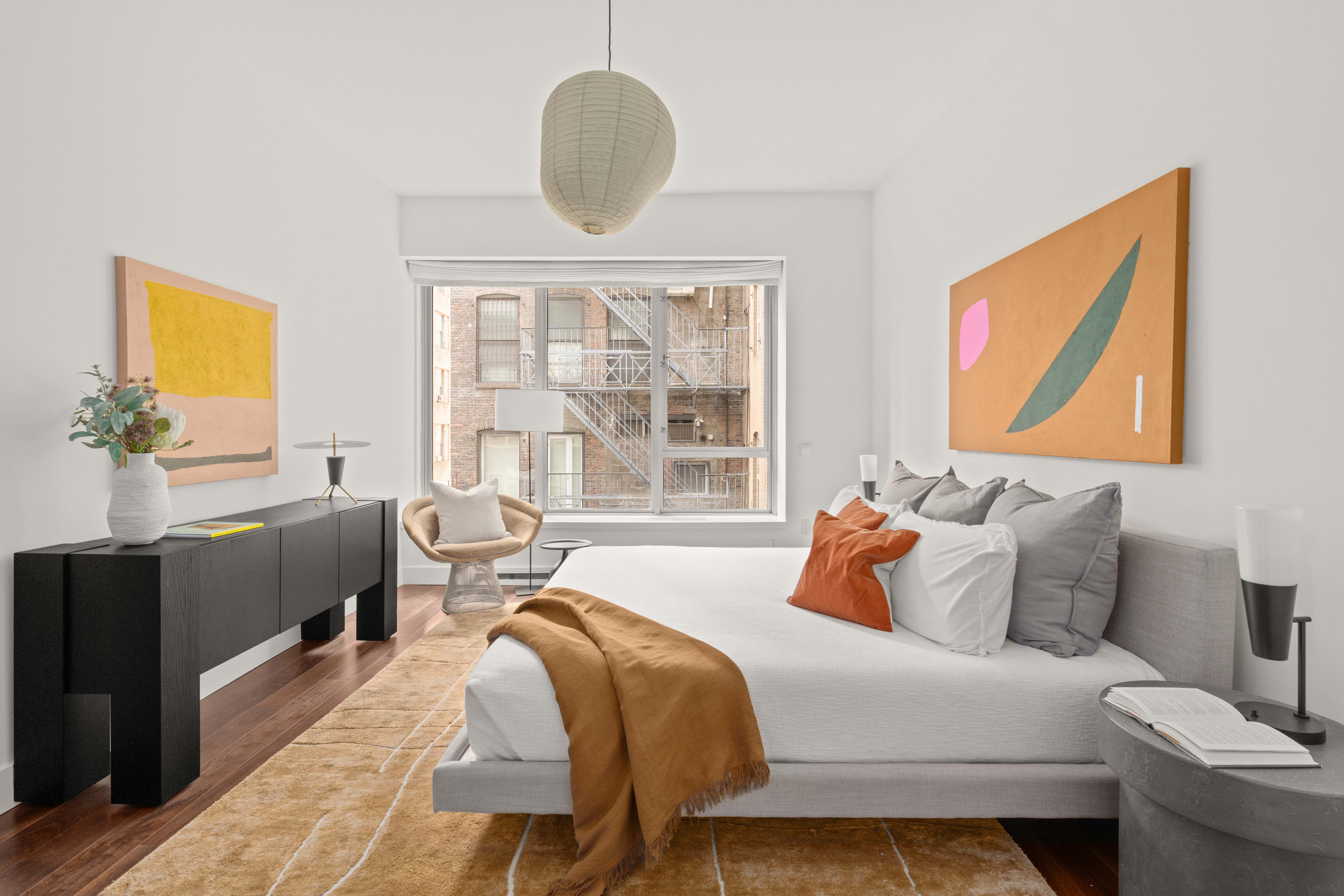 48 Bond Street, Unit 4B Manhattan, NY 10012 - Photo 6 of 15 a bedroom with a bed and wooden floor