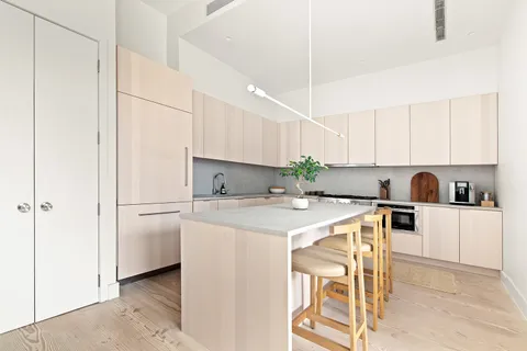 a kitchen with a white cabinets and white appliances