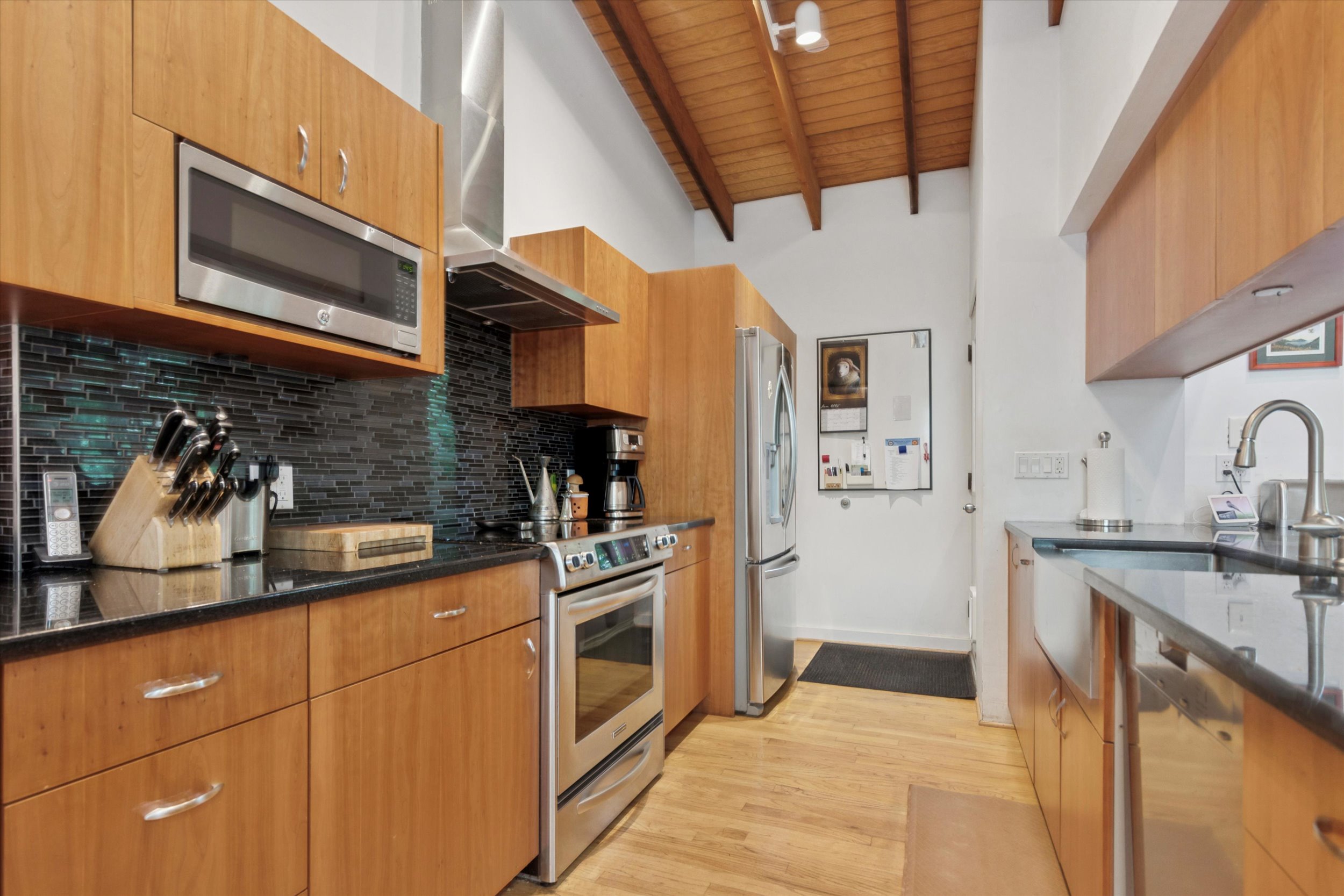 376 Merion Road Merion Station, PA 19066 - Photo 5 of 35 a kitchen with stainless steel appliances granite countertop a sink and cabinets