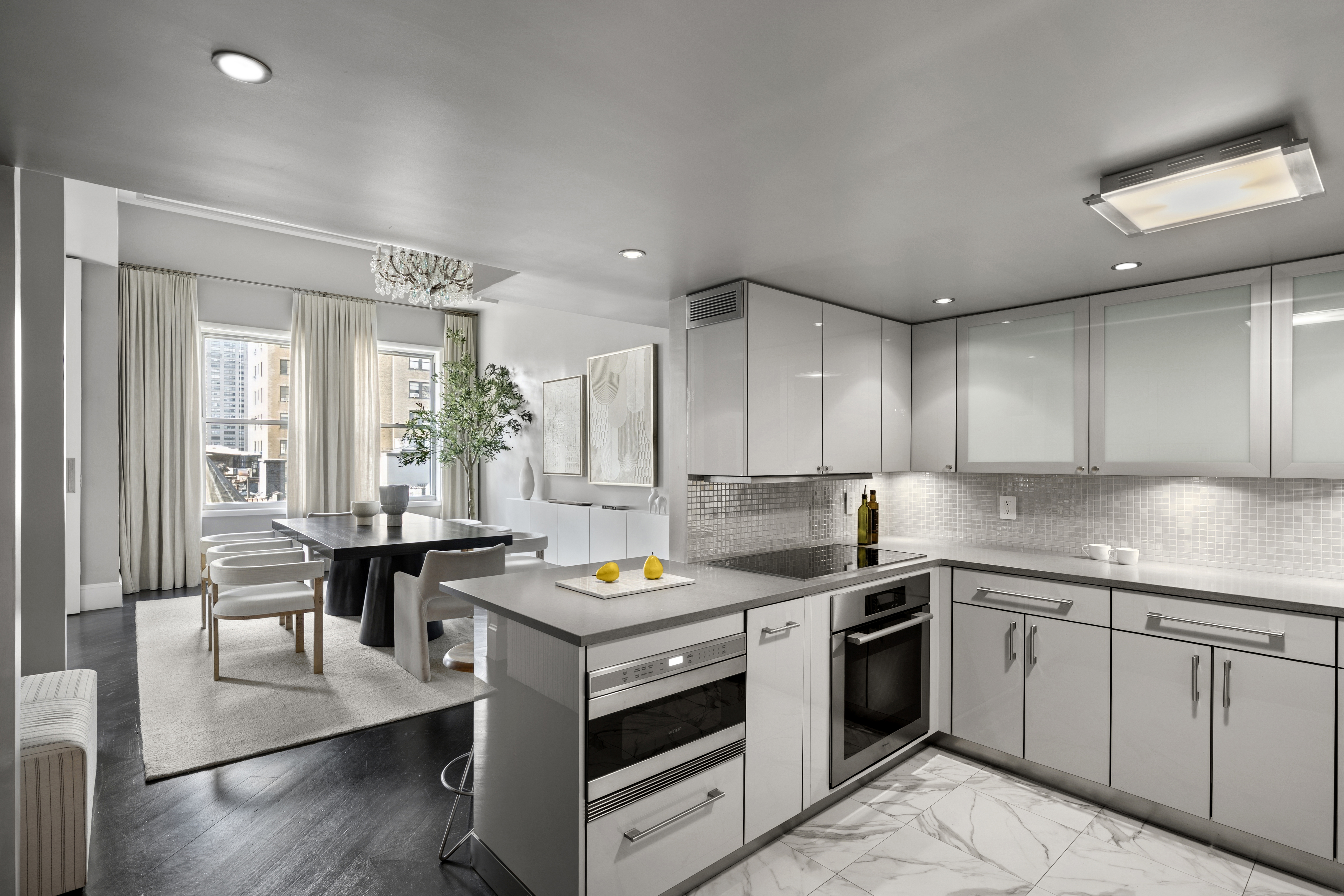 253 West 73rd Street, Unit 6B-C Manhattan, NY 10023 - Photo 8 of 21 a kitchen with a sink stove and cabinets