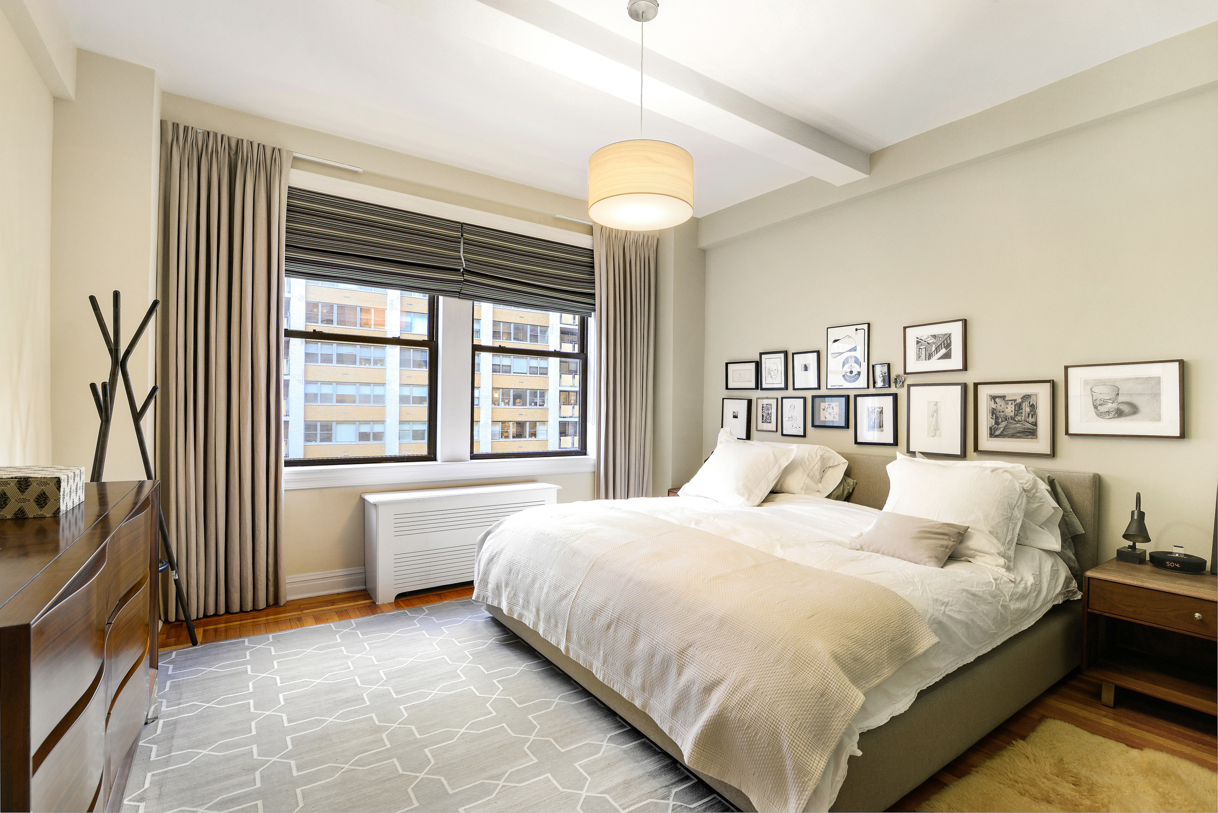 20 West 72nd Street, Unit 601 Manhattan, NY 10023 - Photo 12 of 21 a bedroom with a bed and a large window