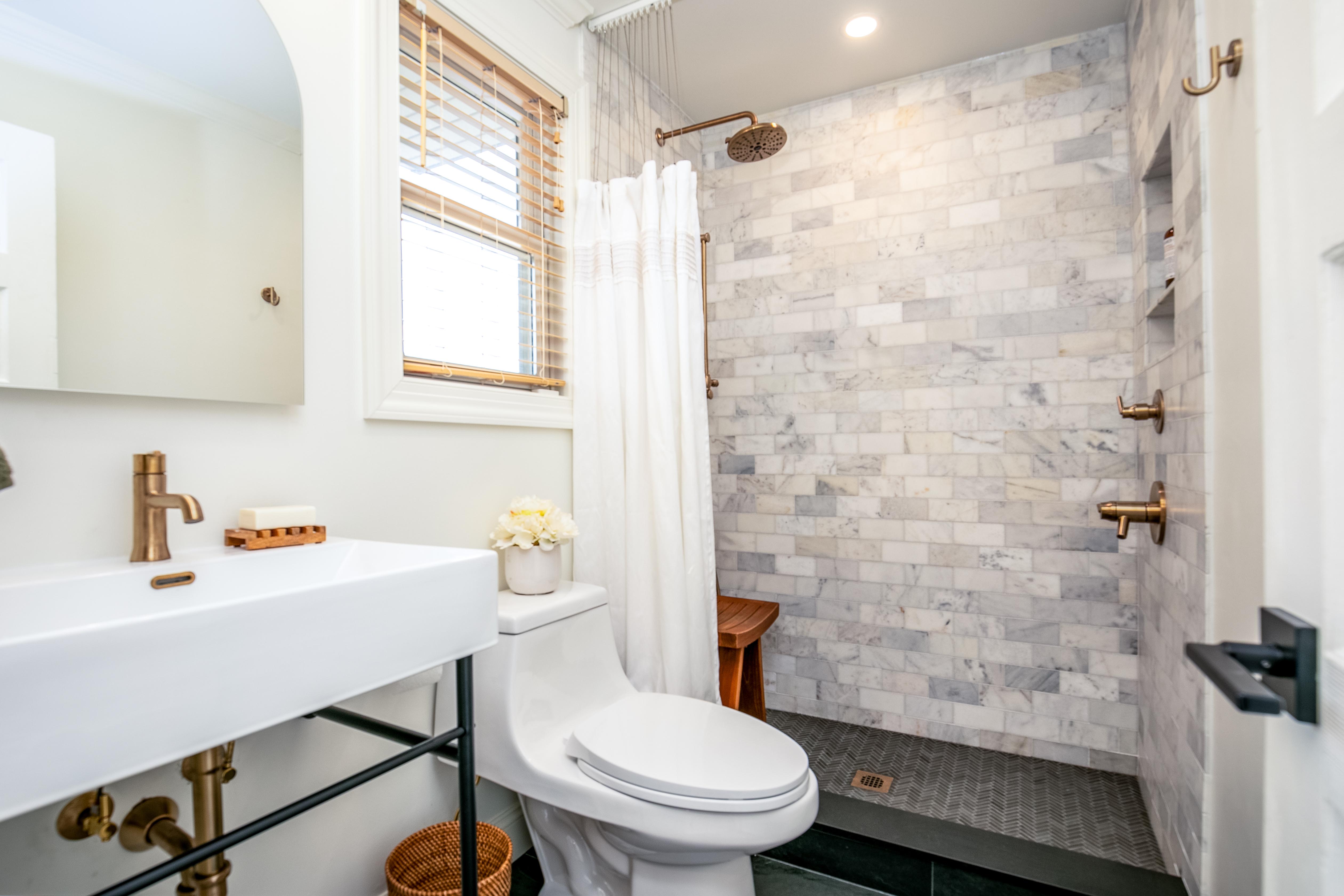 163 Ridge Road Rutherford, NJ 07070 - Photo 24 of 59 a bathroom with a sink a toilet and shower curtain