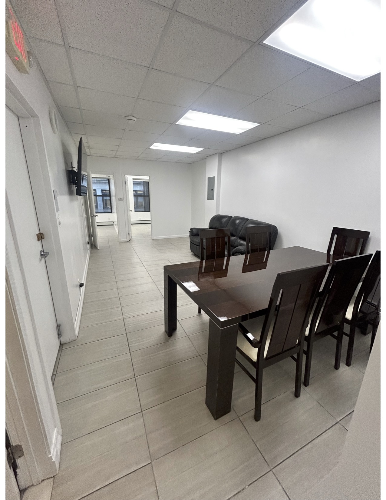 a living room with furniture and a rug