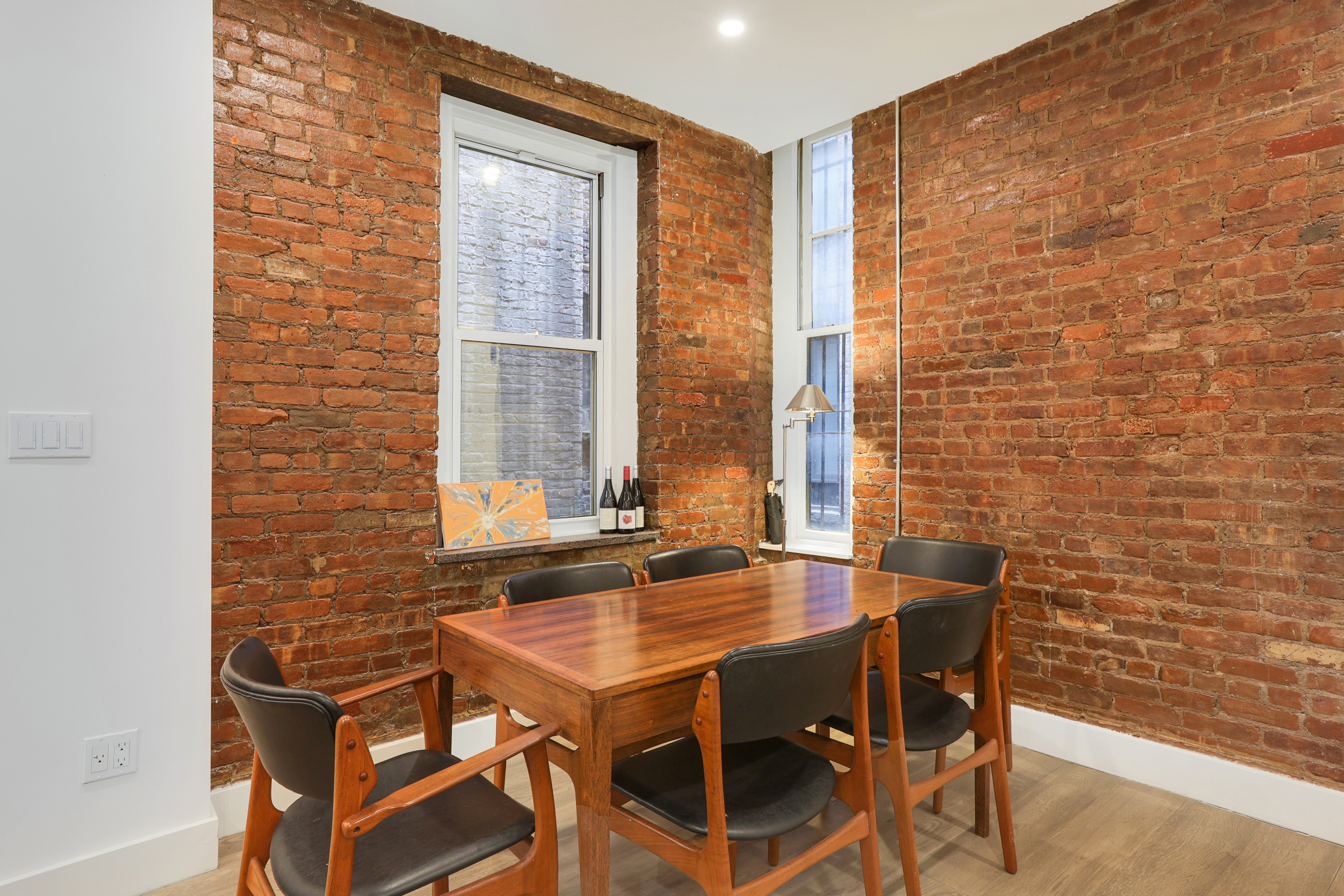 252 East 7th Street, Unit 7/8 Manhattan, NY 10009 - Photo 4 of 13 a view of a dining room with furniture and window