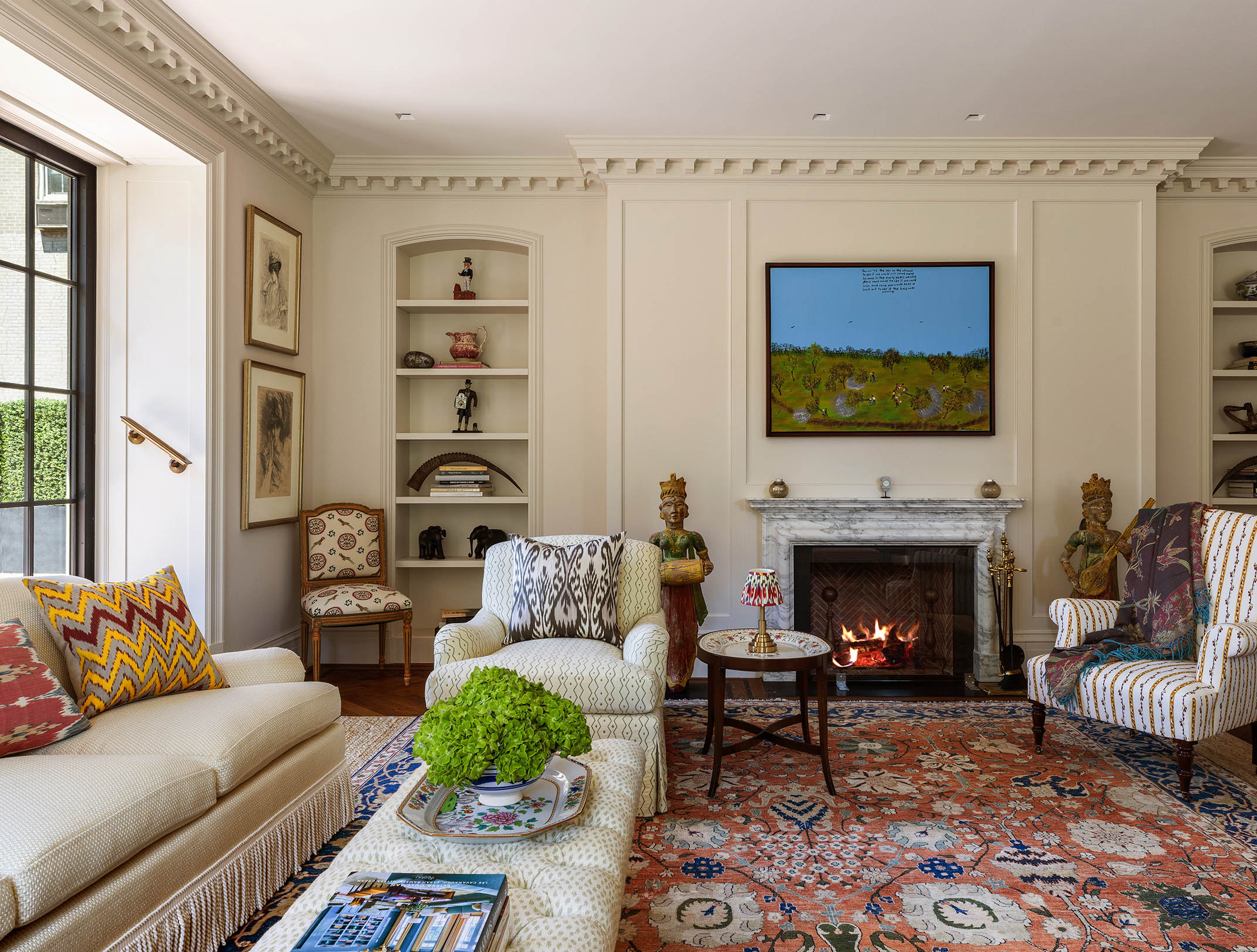 150 East 73rd Street, Unit PH Manhattan, NY 10021 - Photo 4 of 29 a living room with furniture a flat screen tv and a fireplace