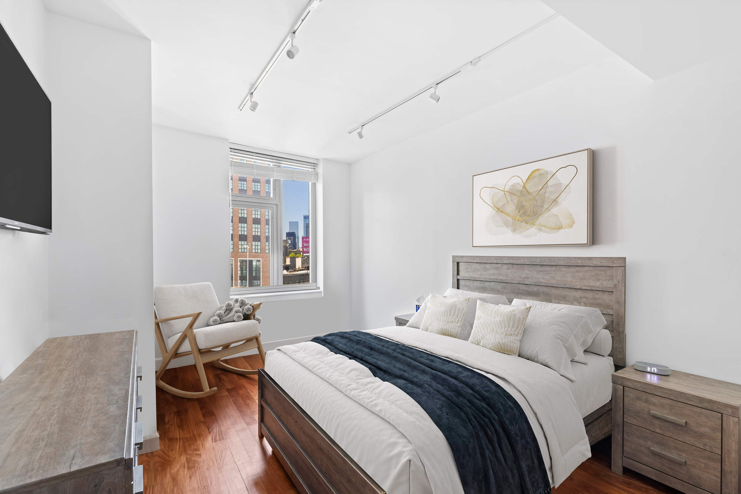100 Jay Street, Unit 12K Brooklyn, NY 11201 - Photo 6 of 14 a bedroom with a bed and wooden floor