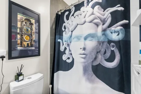 a bathroom with a toilet and a sink