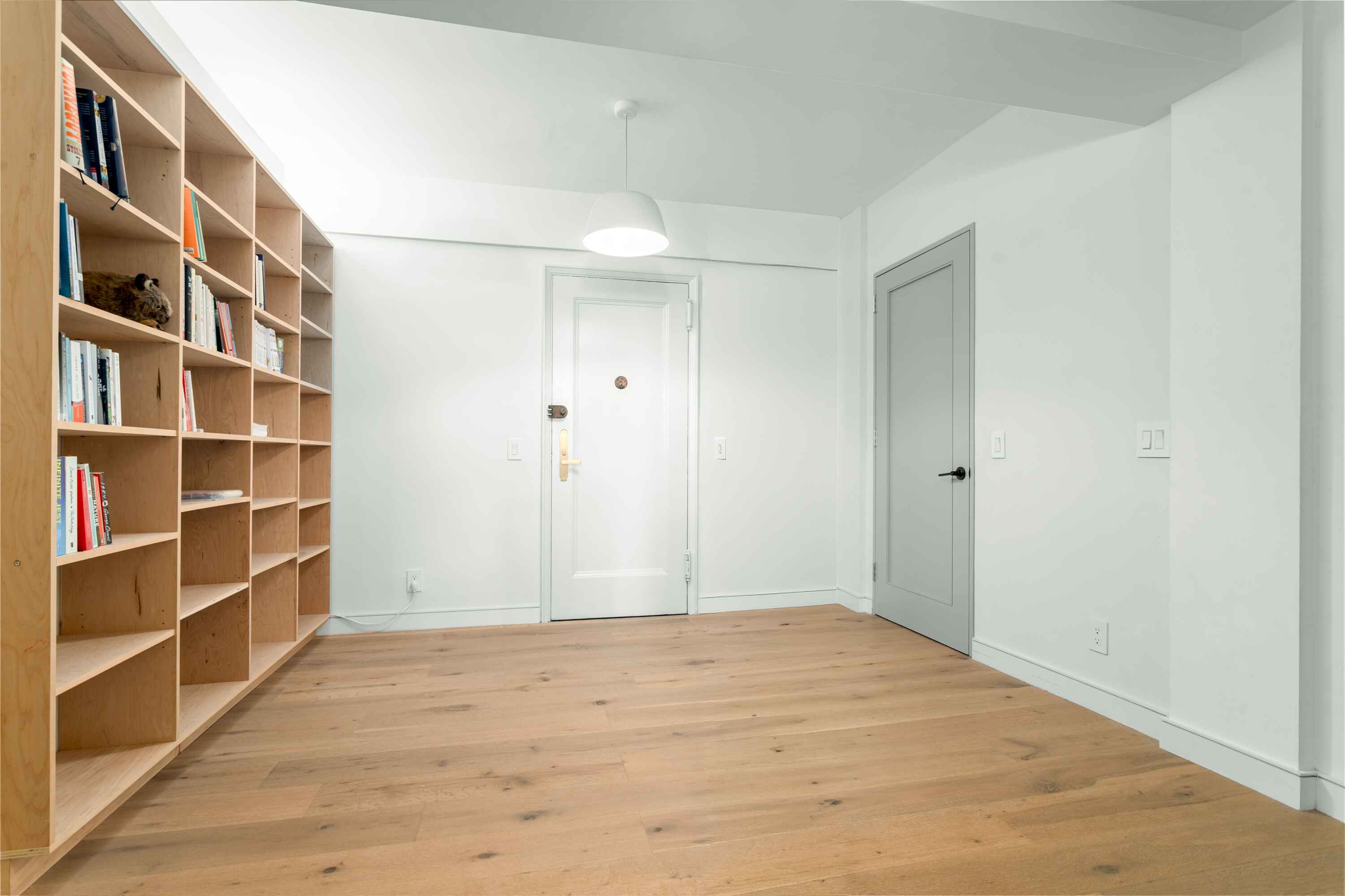 320 West 76th Street, Unit 7DE Manhattan, NY 10023 - Photo 10 of 21 a view of an empty room with empty shelves