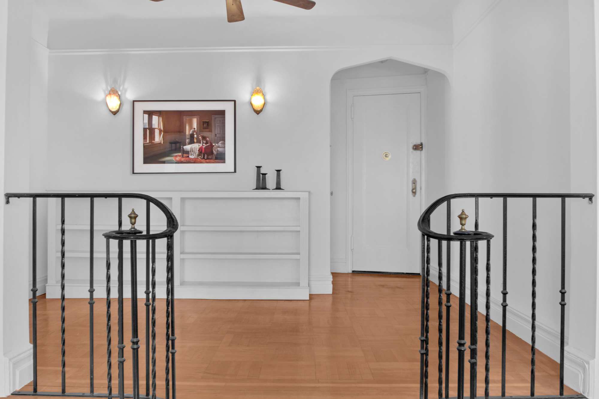 200 Pinehurst Avenue, Unit 5C Manhattan, NY 10033 - Photo 5 of 17 a view of a hallway with wooden floor and stairs
