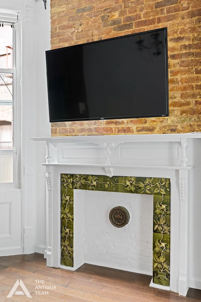 a stove top oven sitting inside of a kitchen