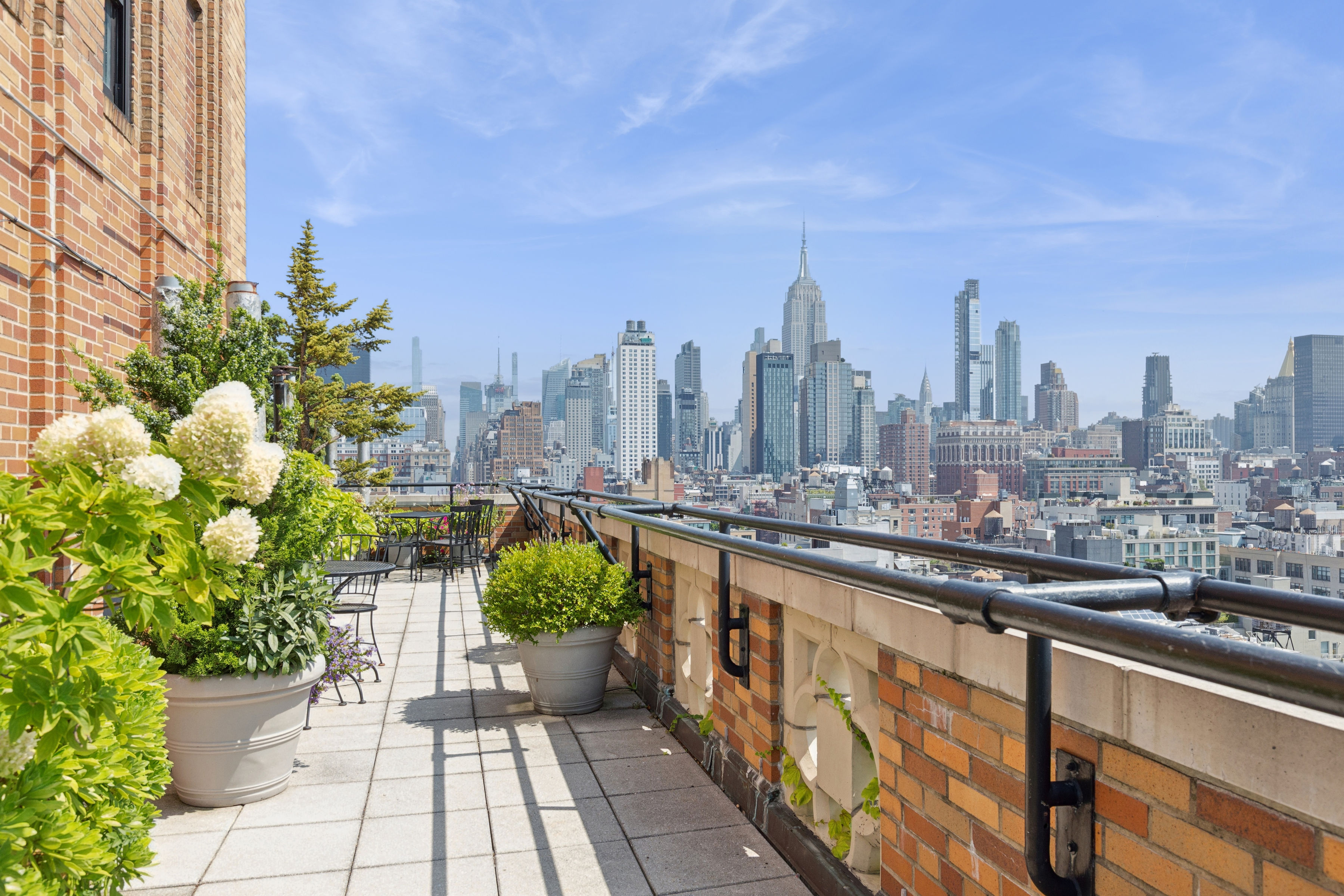 201 West 16th Street, Unit 7C Manhattan, NY 10011 - Photo 5 of 8 a view of a city with tall buildings
