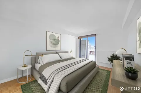 a bedroom with a bed and a potted plant