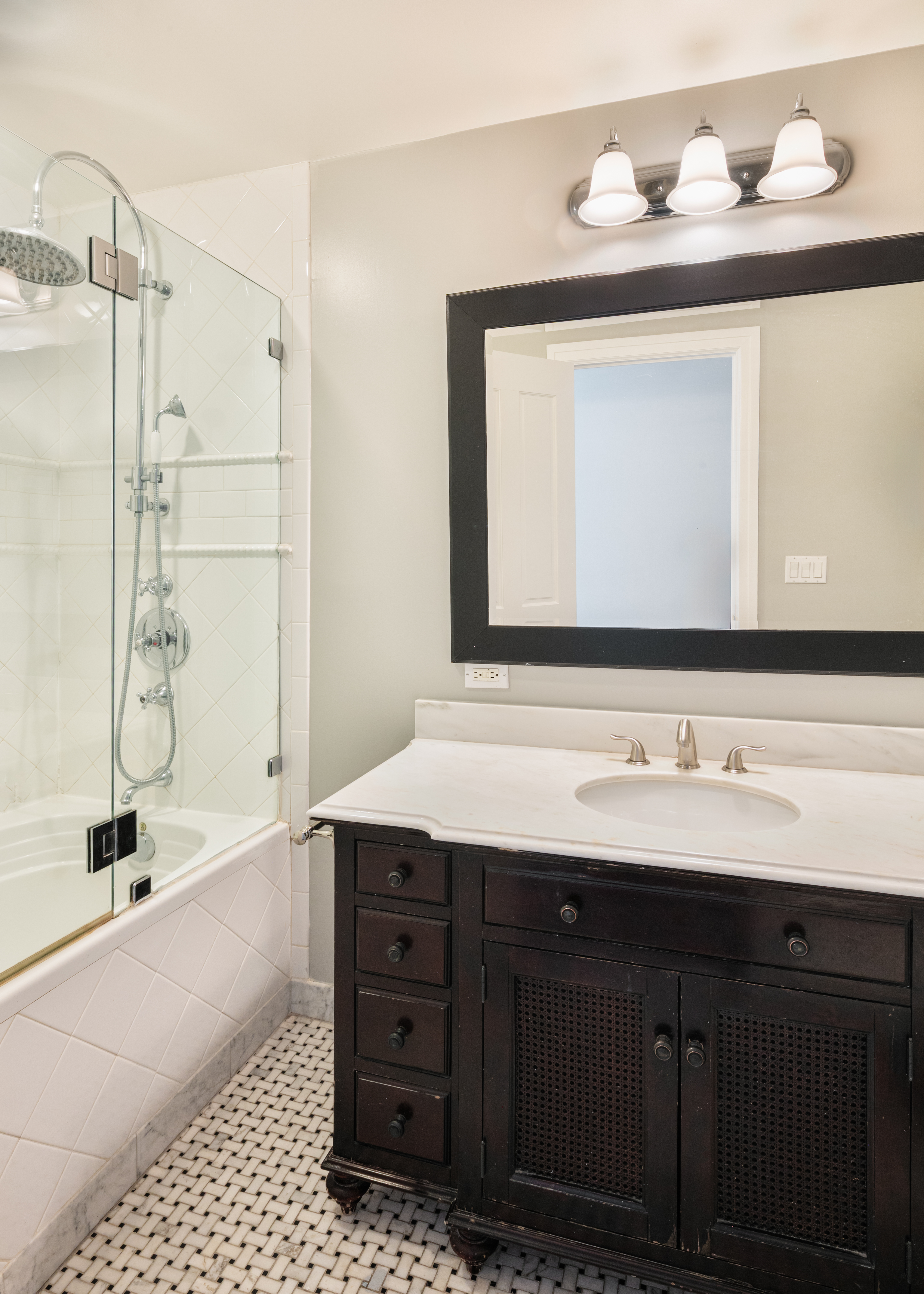 112 West 78th Street, Unit PARLOR Manhattan, NY 10024 - Photo 24 of 37 a bathroom with a sink vanity granite tub and a mirror
