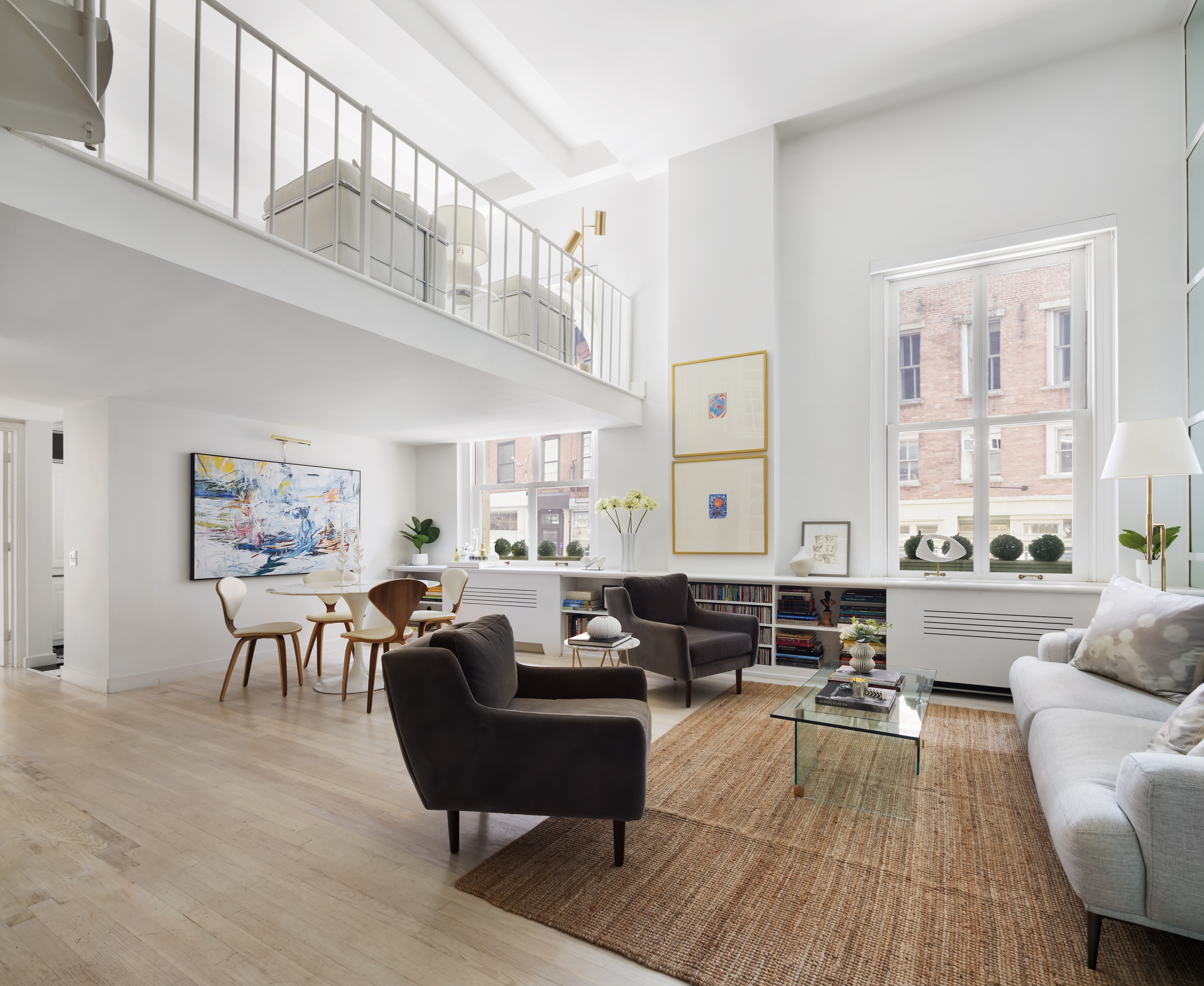 240 Centre Street, Unit 2J Manhattan, NY 10013 - Photo 7 of 18 a living room with furniture kitchen view and a large window