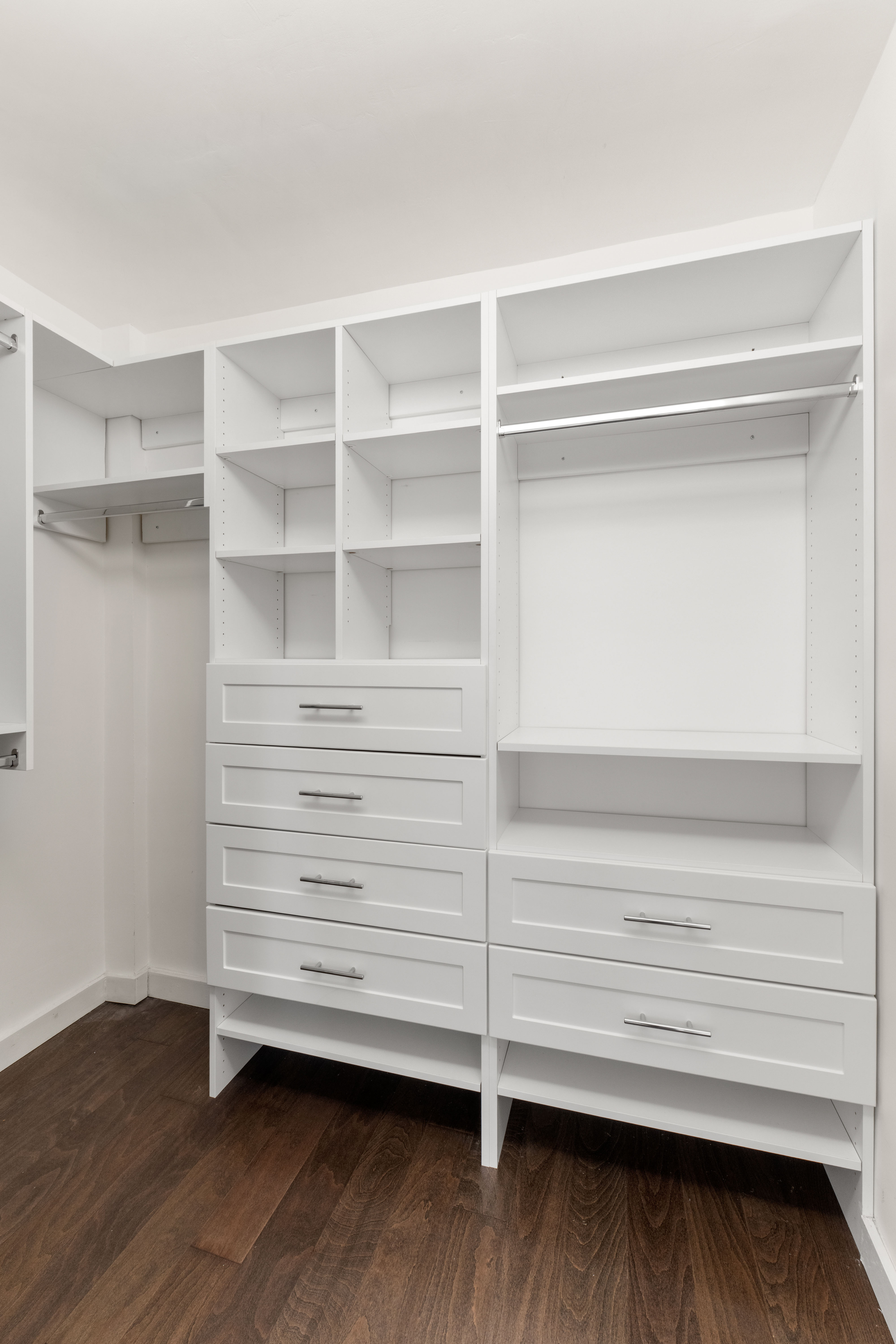 66-36 Yellowstone Boulevard, Unit 24A Queens, NY 11375 - Photo 11 of 20 a view of walk in closet with empty racks