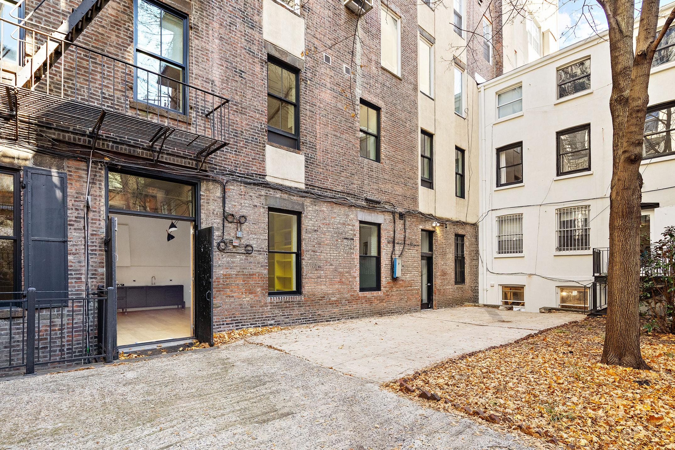 140 Sullivan Street, Unit 1FR Manhattan, NY 10012 - Photo 15 of 19 a view of a building on a street