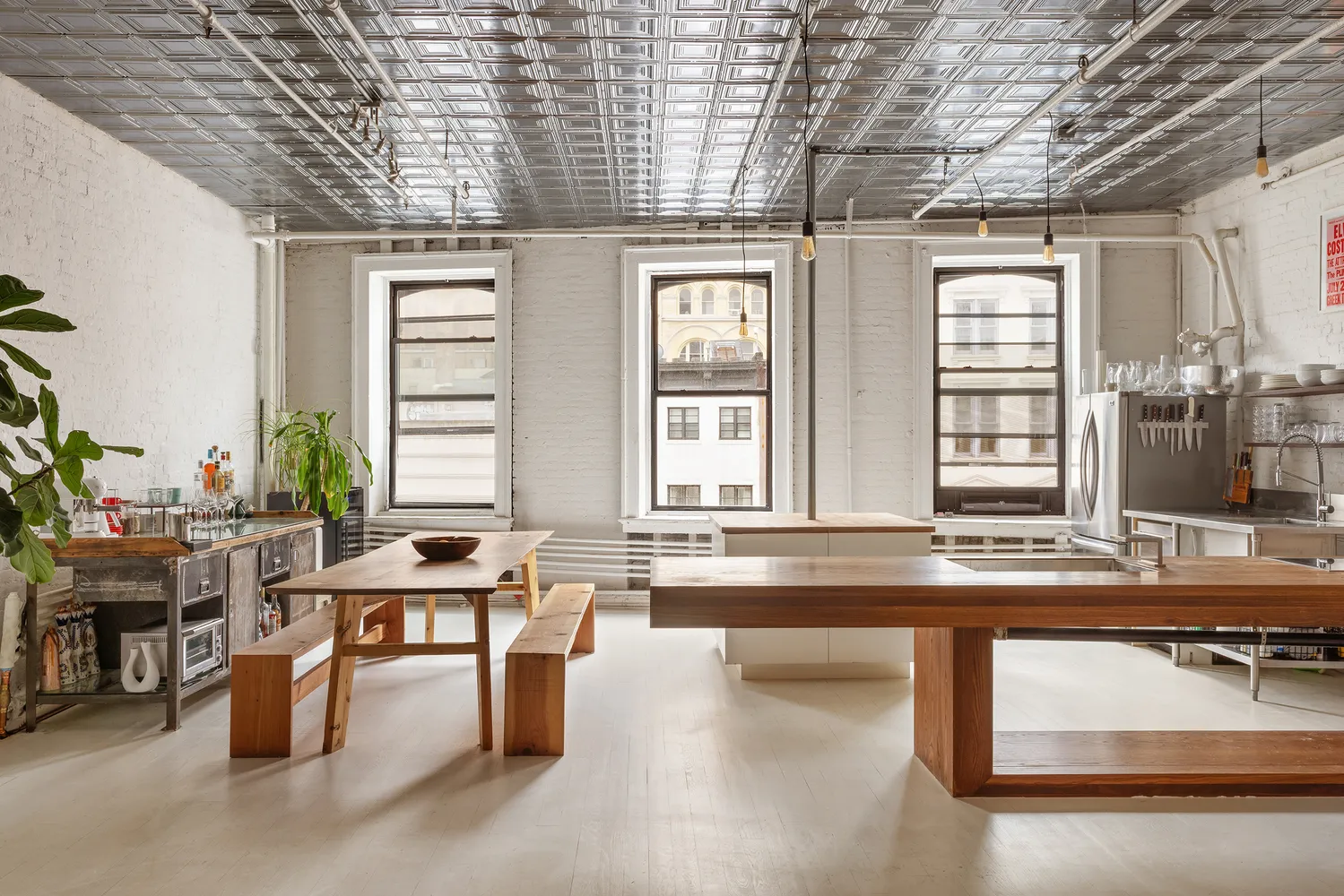 a kitchen with stainless steel appliances granite countertop a sink and a counter space