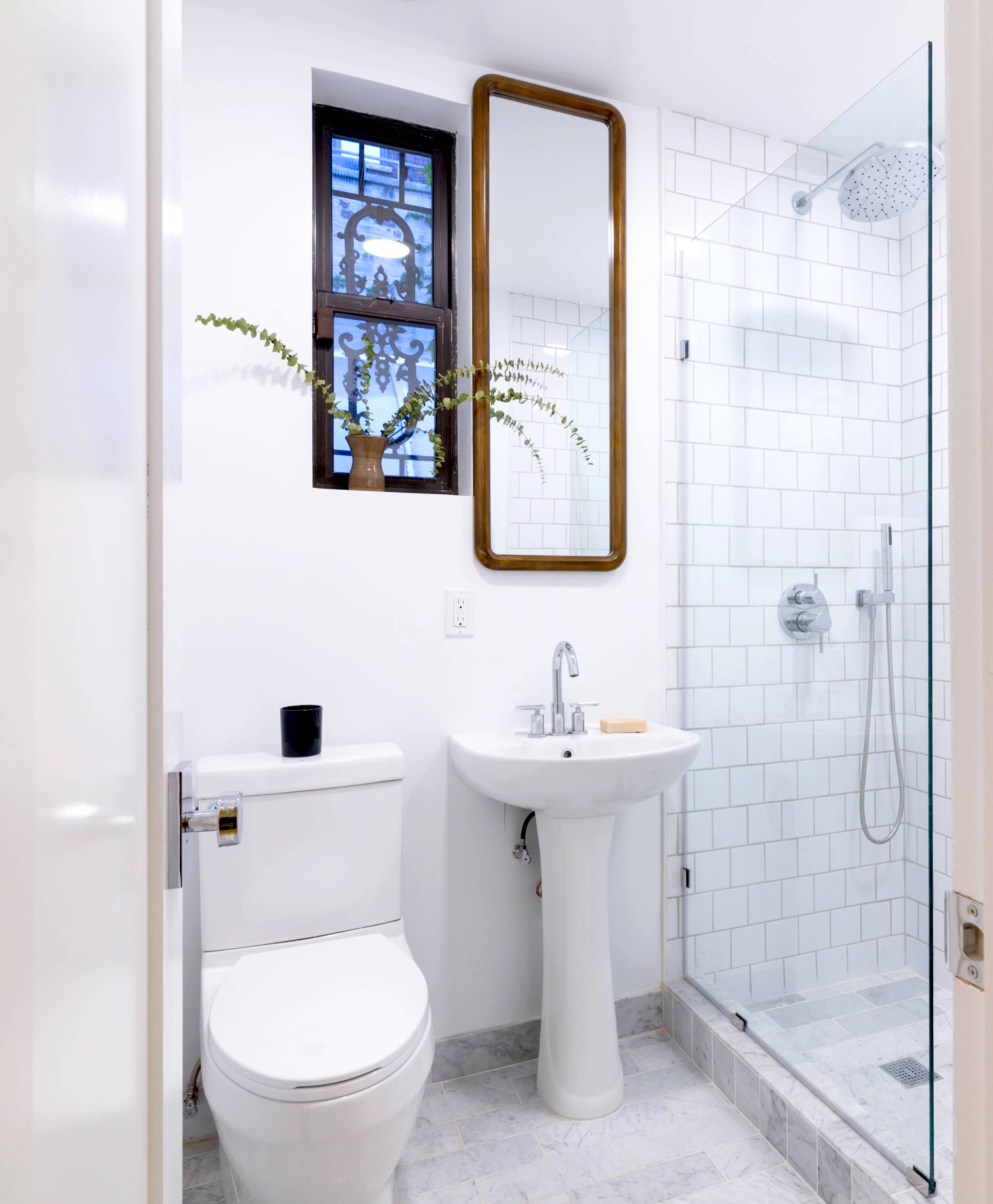349 West 71st Street, Unit 1 Manhattan, NY 10023 - Photo 9 of 21 a white toilet sitting next to a bathroom sink