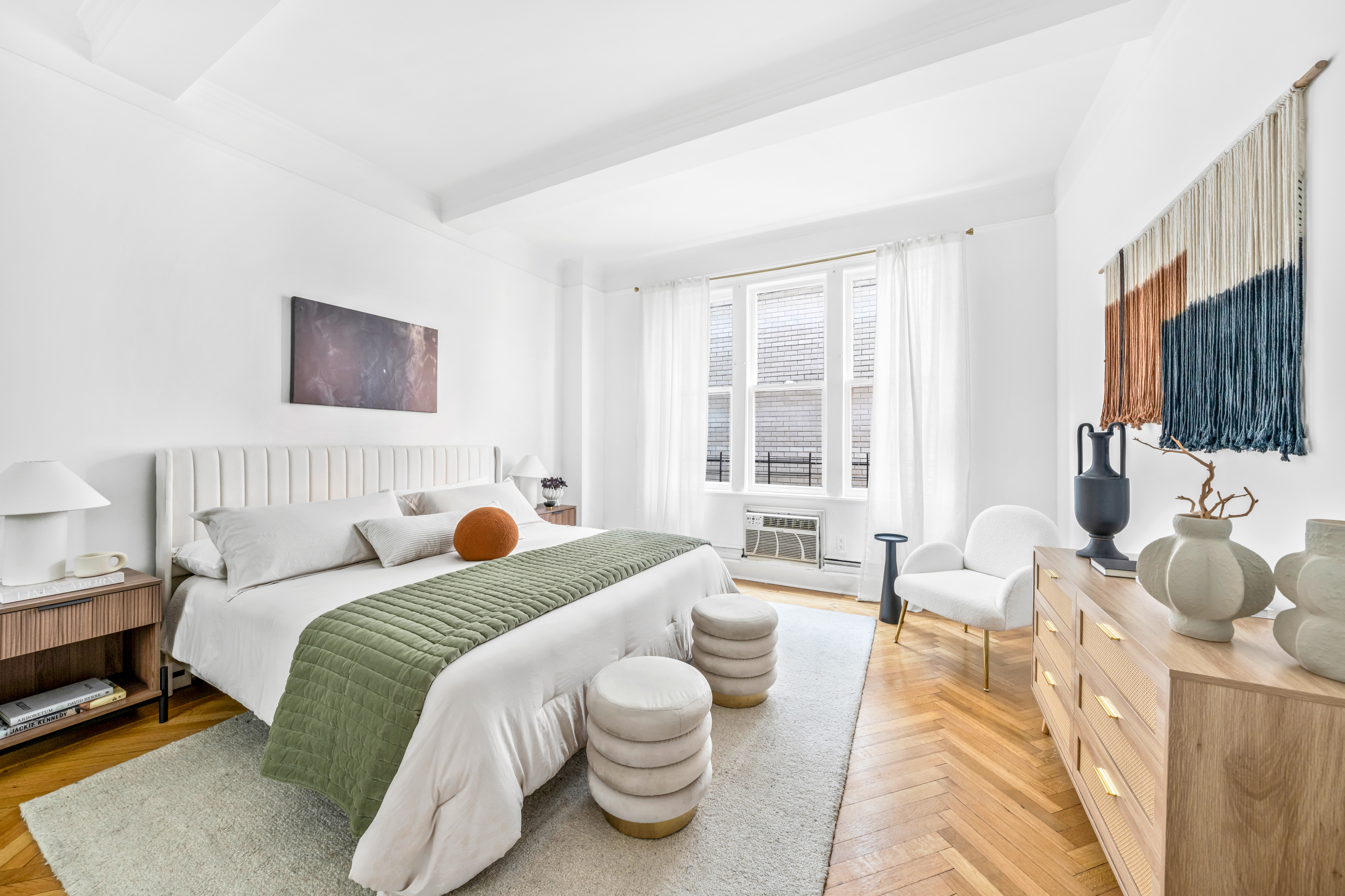 1060 Park Avenue, Unit 11A Manhattan, NY 10128 - Photo 5 of 11 a bedroom with a bed and glass window