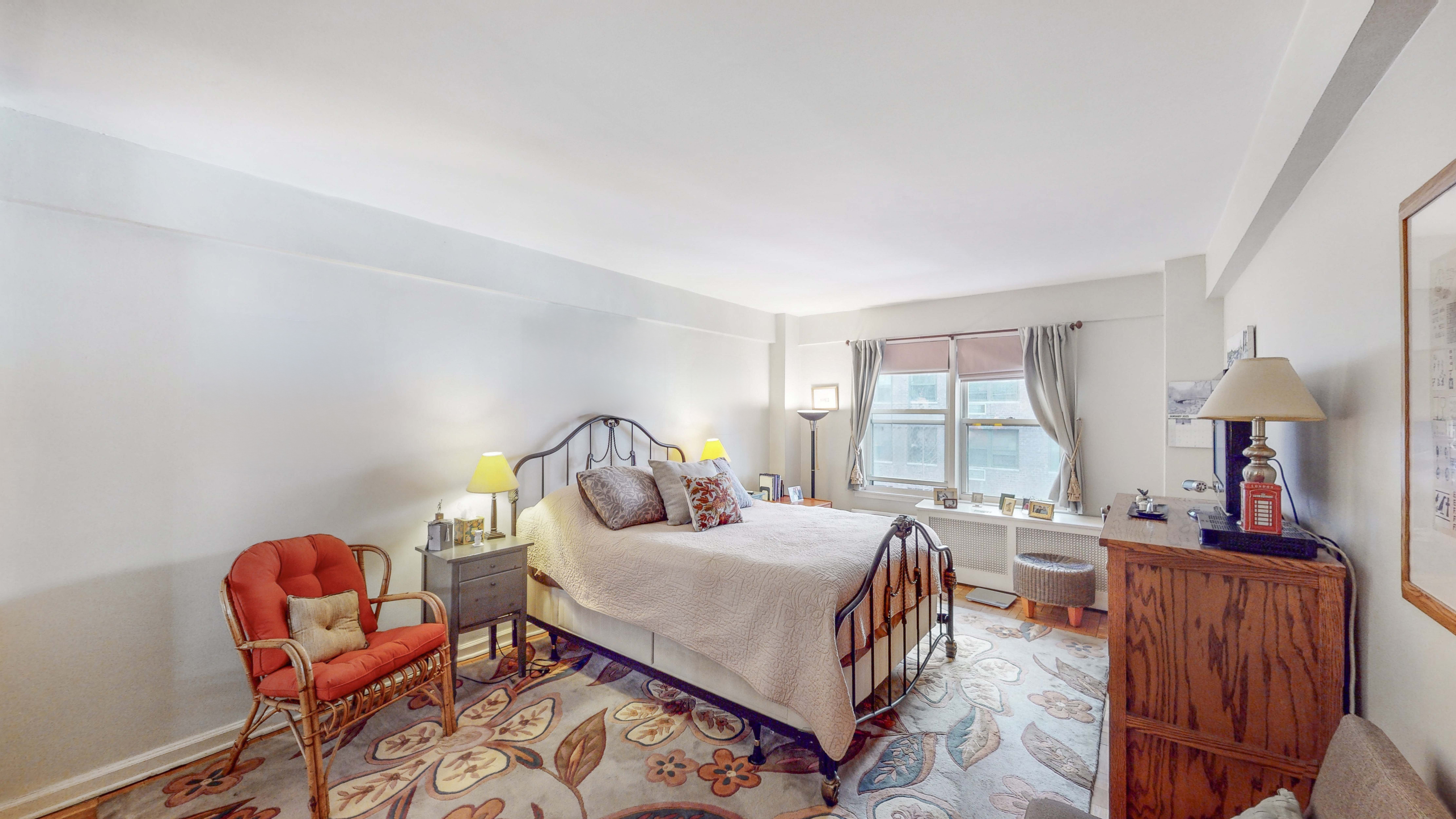 515 East 85th Street, Unit 6A Manhattan, NY 10028 - Photo 6 of 11 a bedroom with furniture and a window