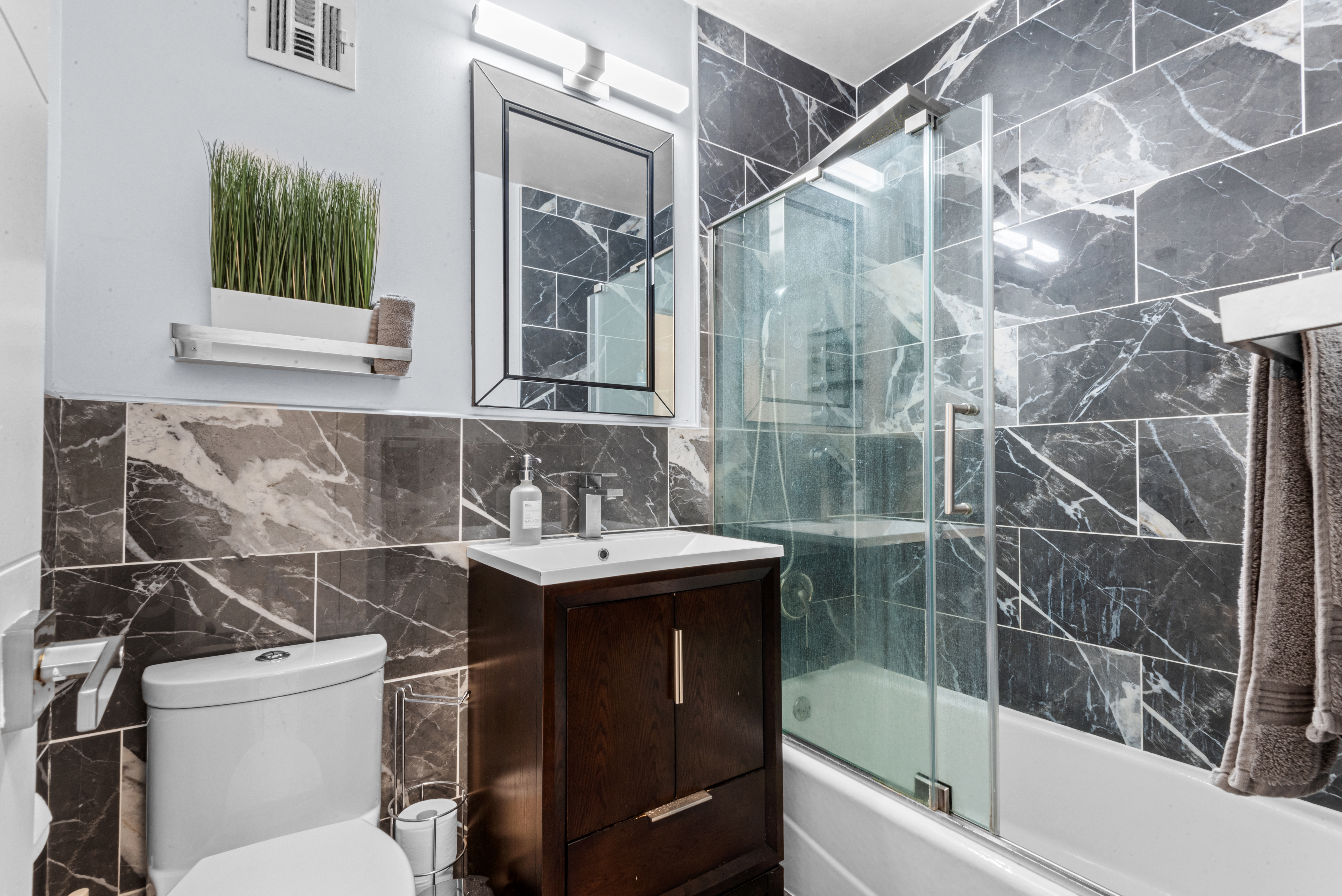 4 Horizon Road, Unit 1013 Fort Lee, NJ 07024 - Photo 11 of 18 a bathroom with a sink toilet and shower